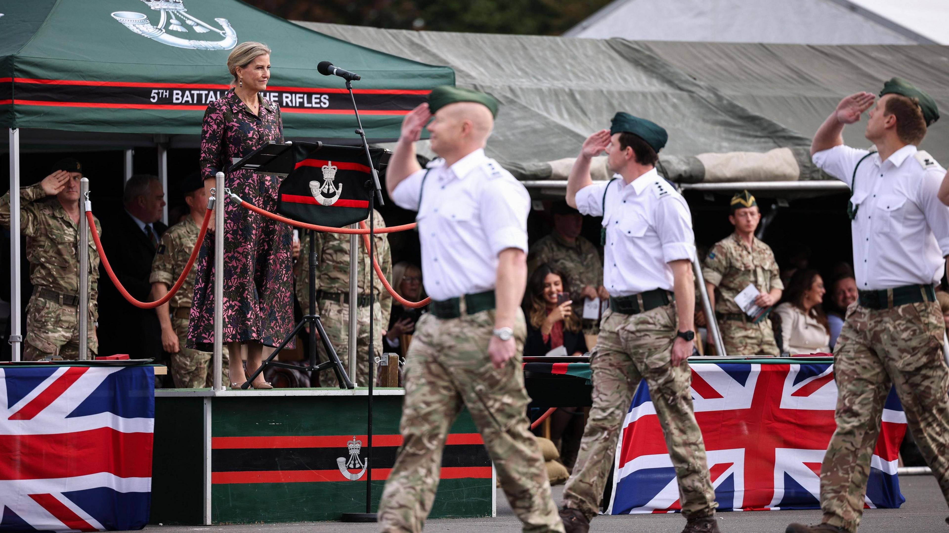 Soldiers saluting the Duchess of Edinburgh an they march past