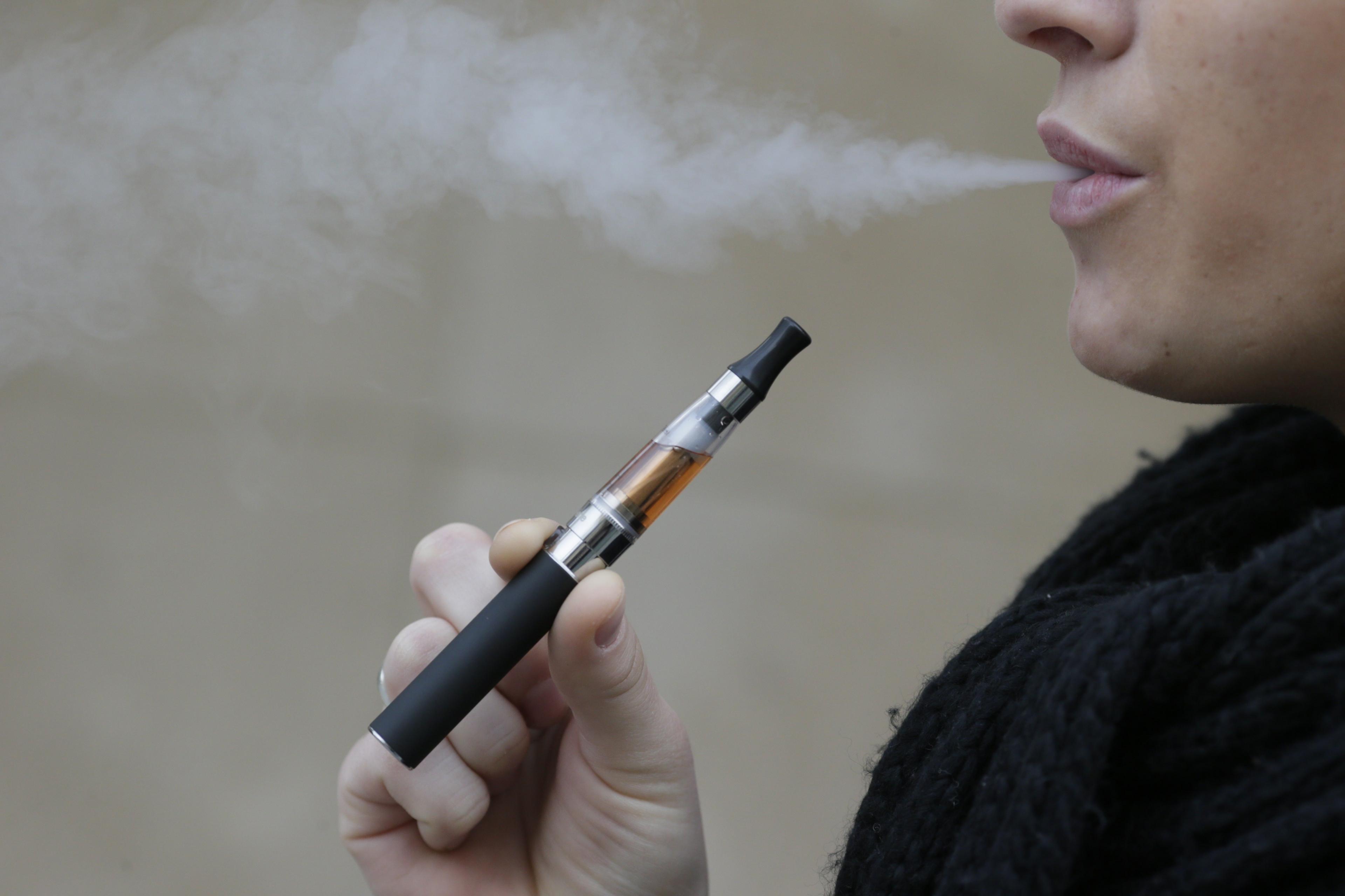 Woman smoking e-cigarette