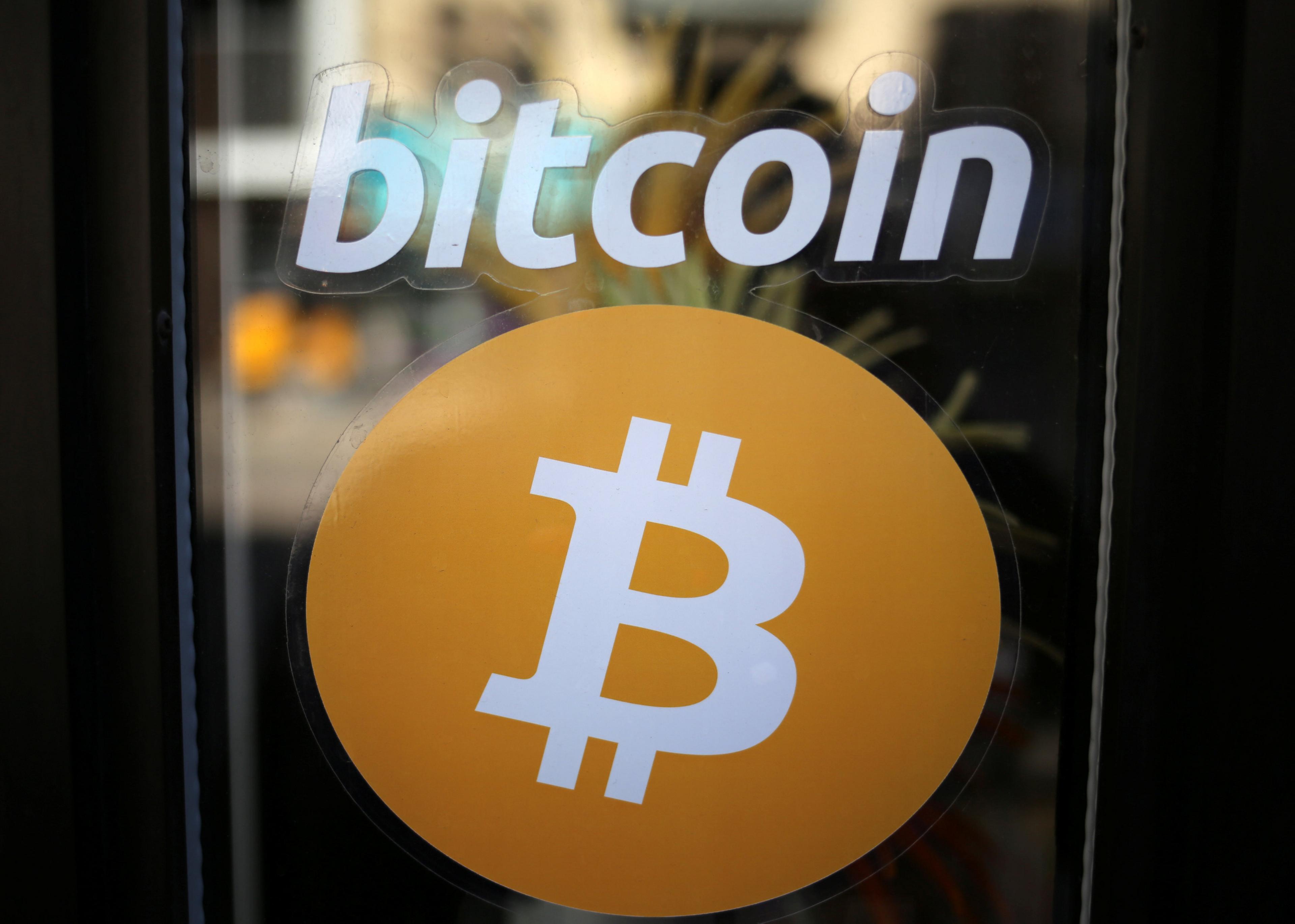 Bitcoin logo on shop window