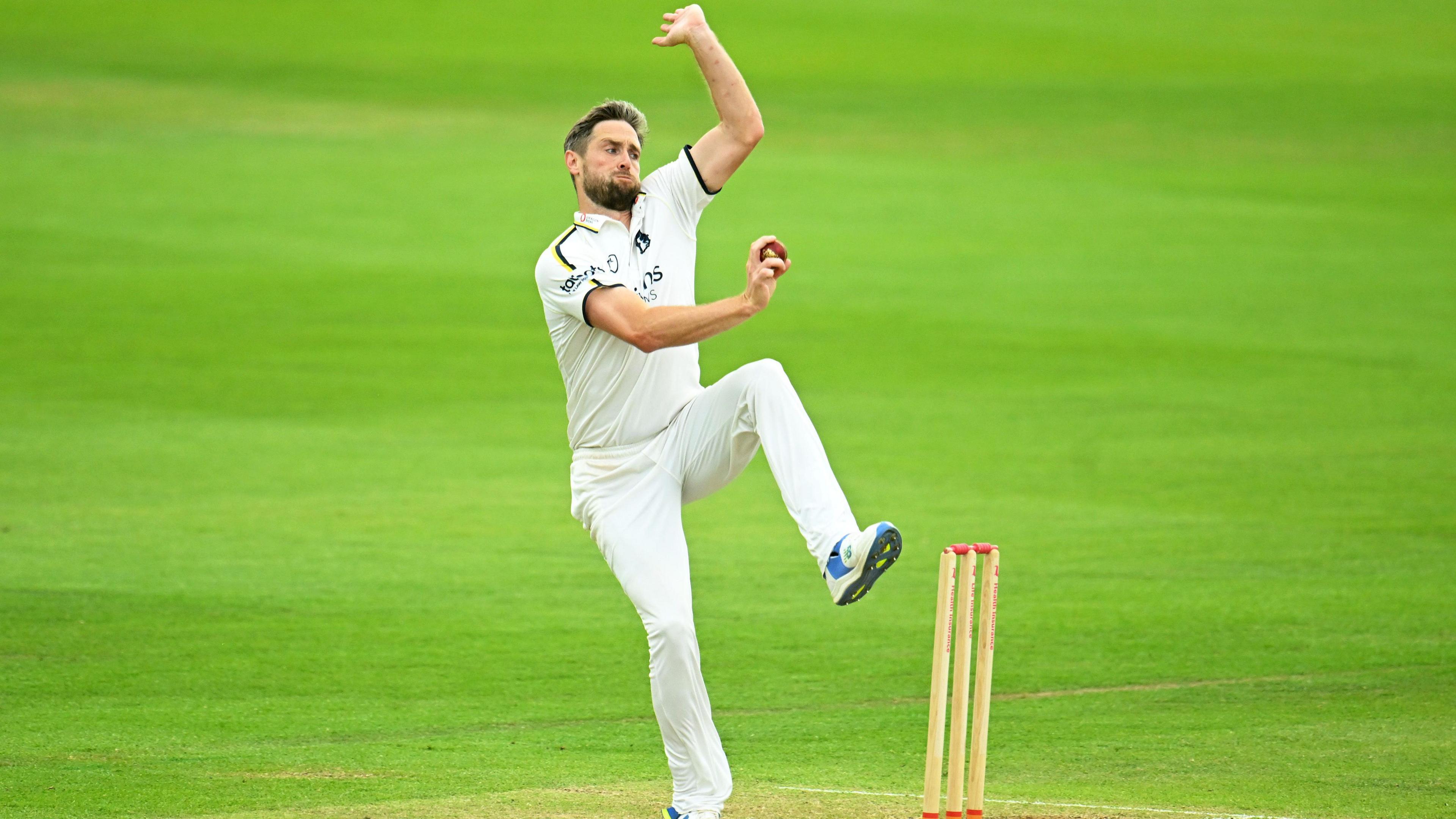 Chris Woakes bowling a cricket ball