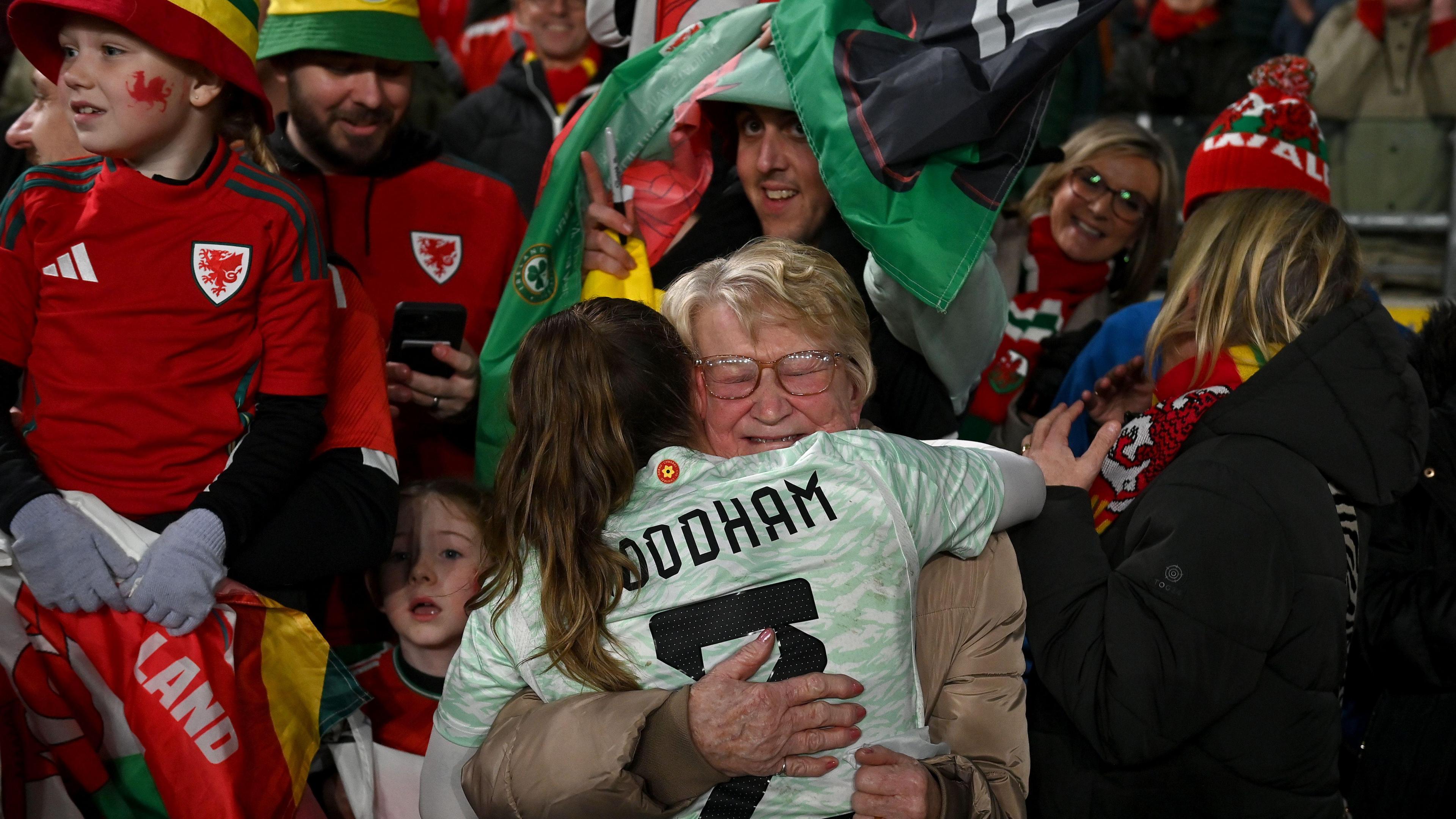 Lily Woodham of Wales celebrates with family following the UEFA Women's EURO 2025 Play-Off Round Two Second Leg match between Republic of Ireland and Wales at Aviva Stadium on December 03 2024. 