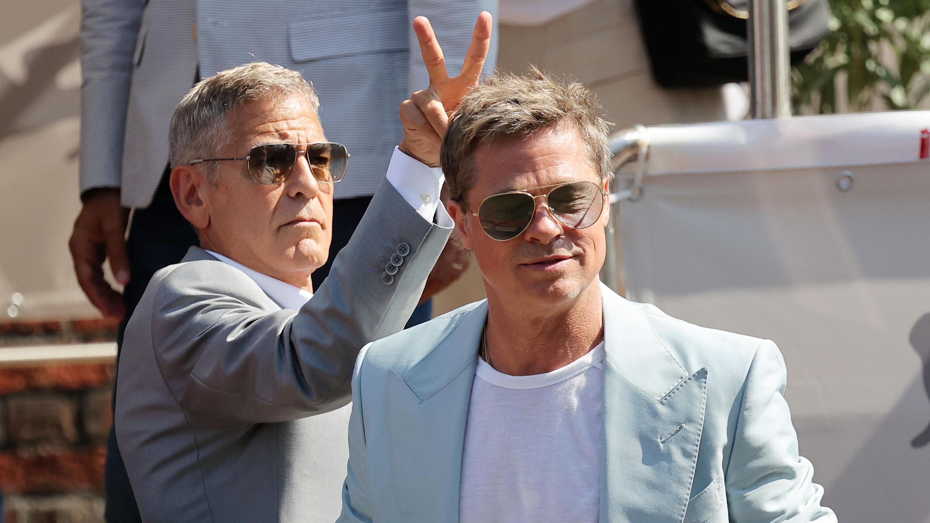 Cast members Brad Pitt and George Clooney arrive via boat to the premiere of "Wolfs" out of competition, at the 81st Venice Film Festival, Venice, Italy, September 1, 2024