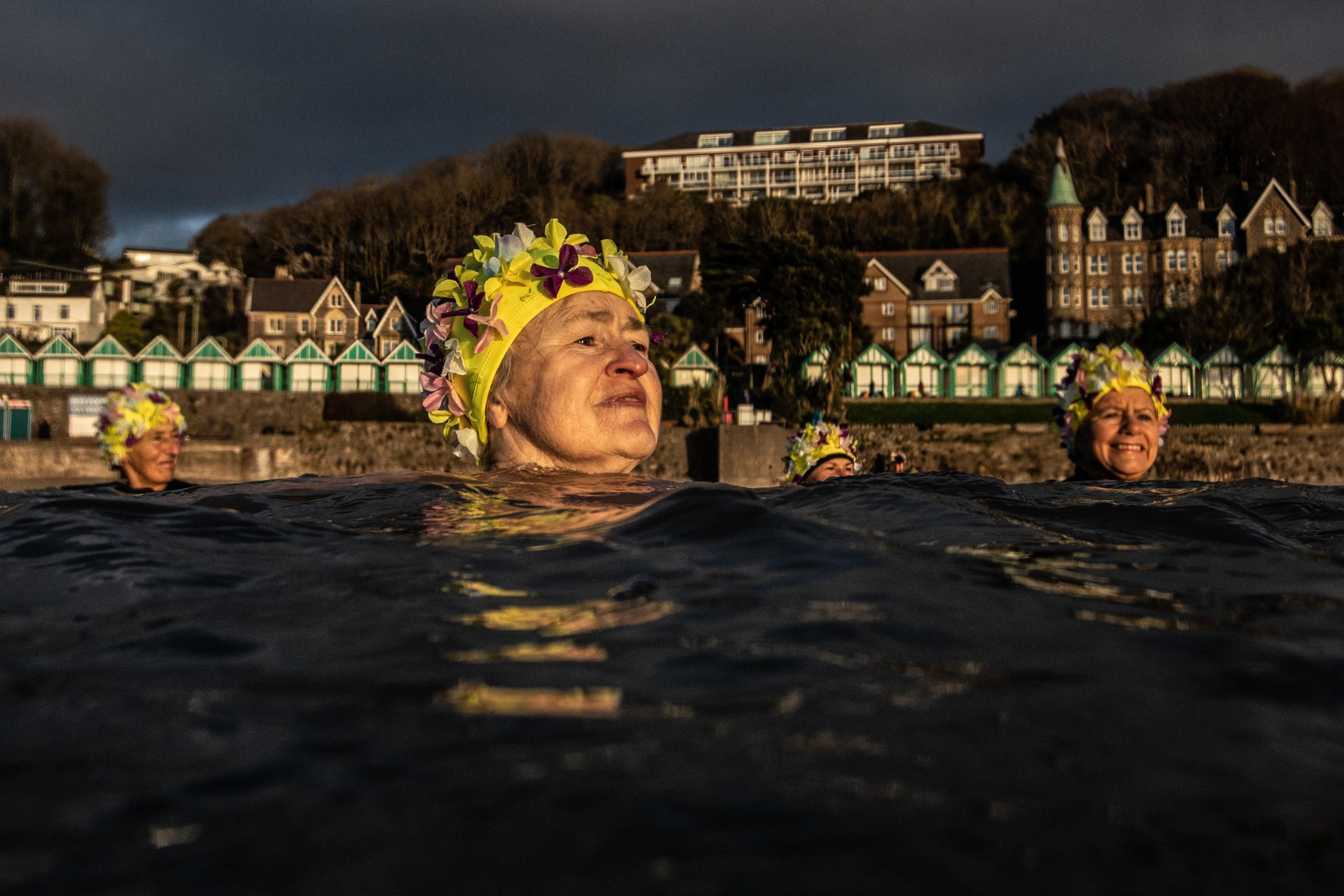 Women swimming in Langland Bay