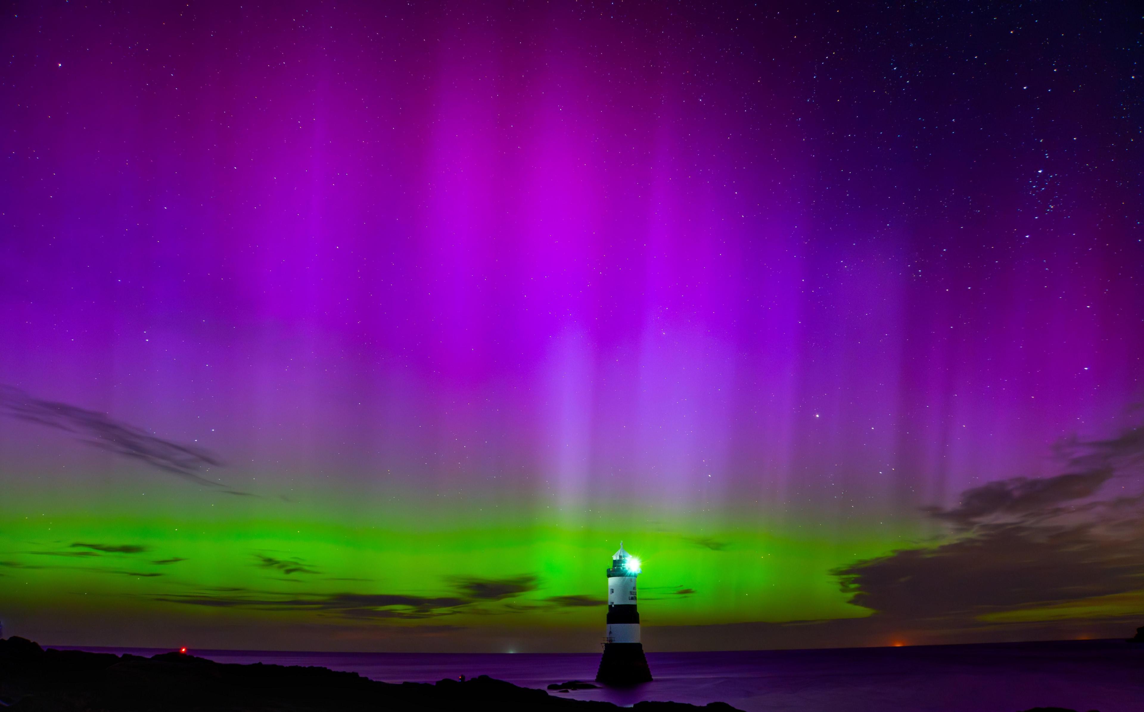 Picture of an aurora display along the coast in Penmon, Anglesey 