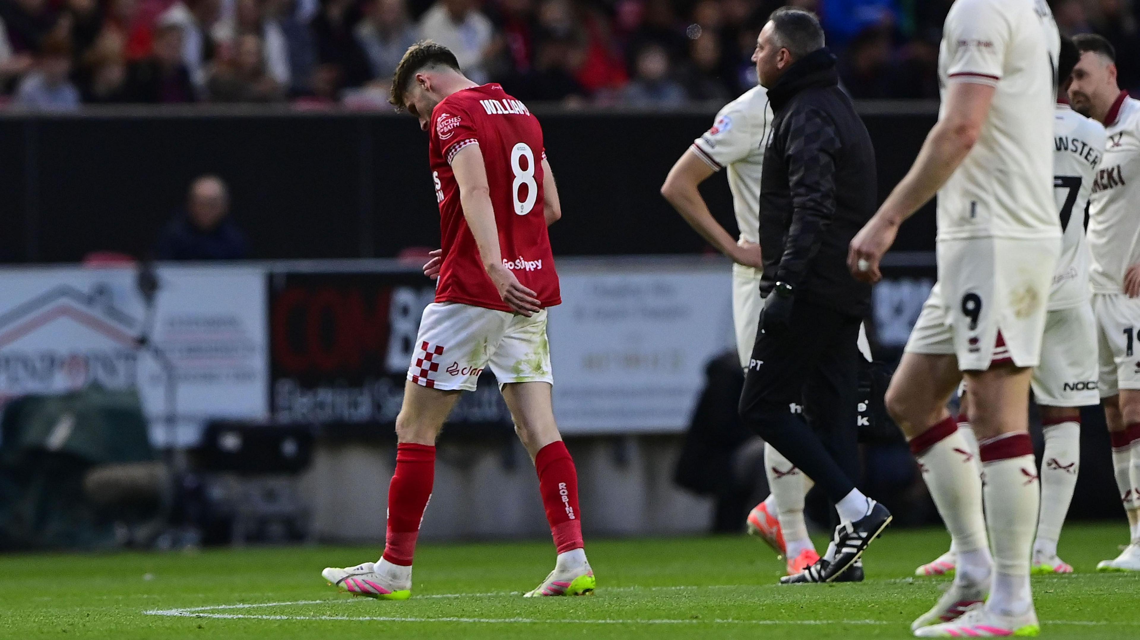 Joe Williams walks off the field with injury