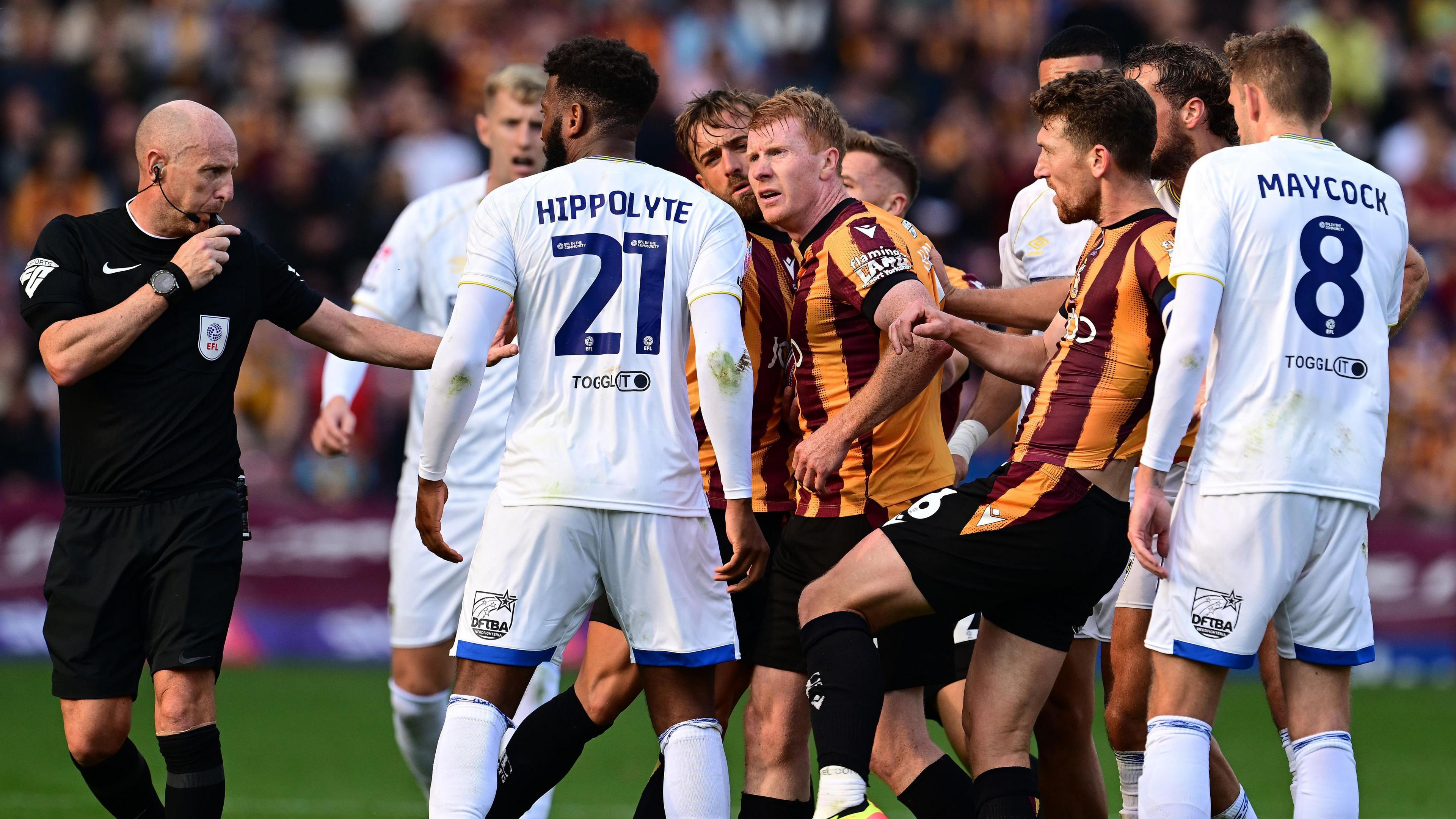 Bradford City and AFC Wimbledon players confront each other 