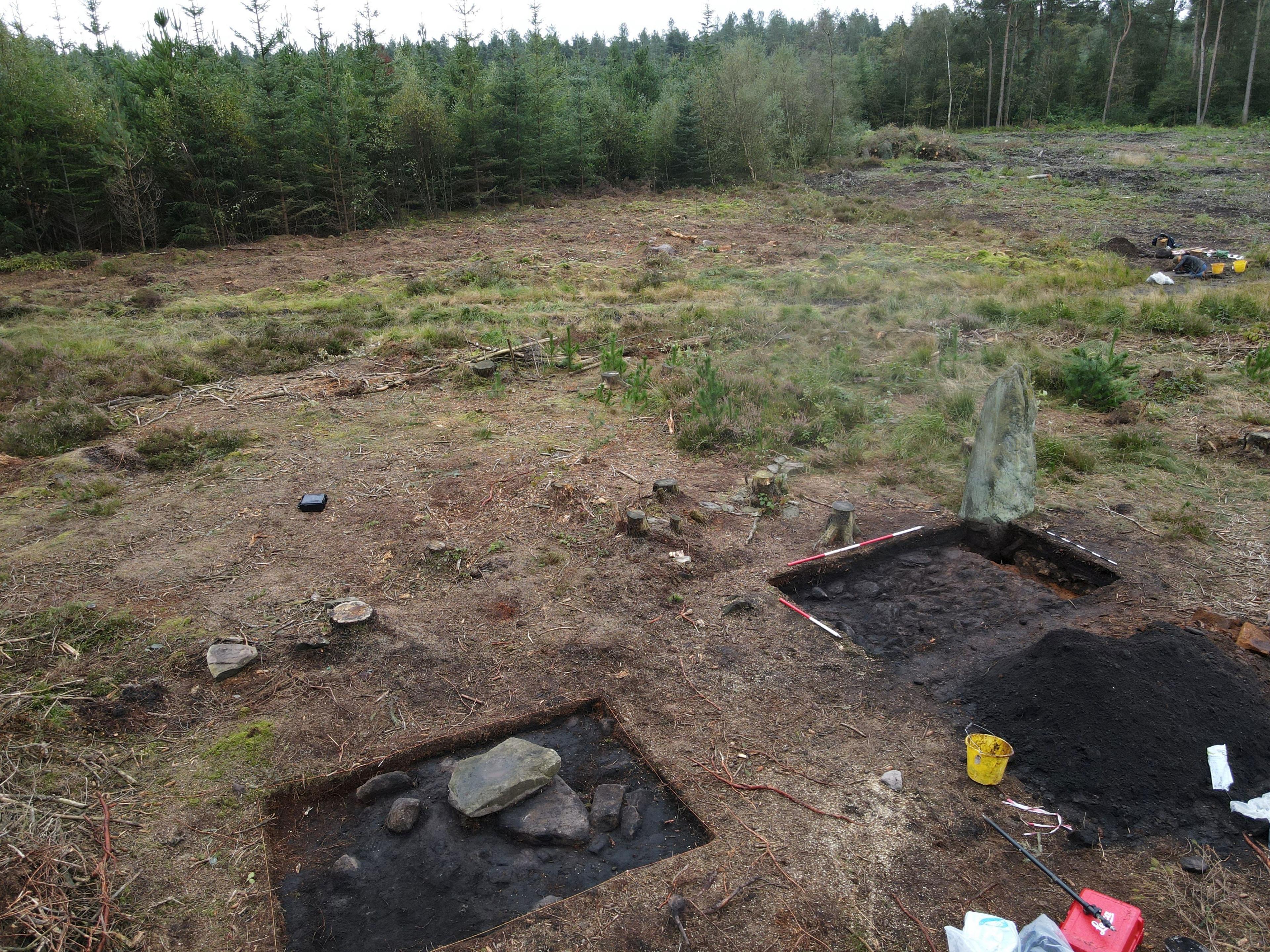 The excavation site from above, the main standing stone can be seen next to two square areas.