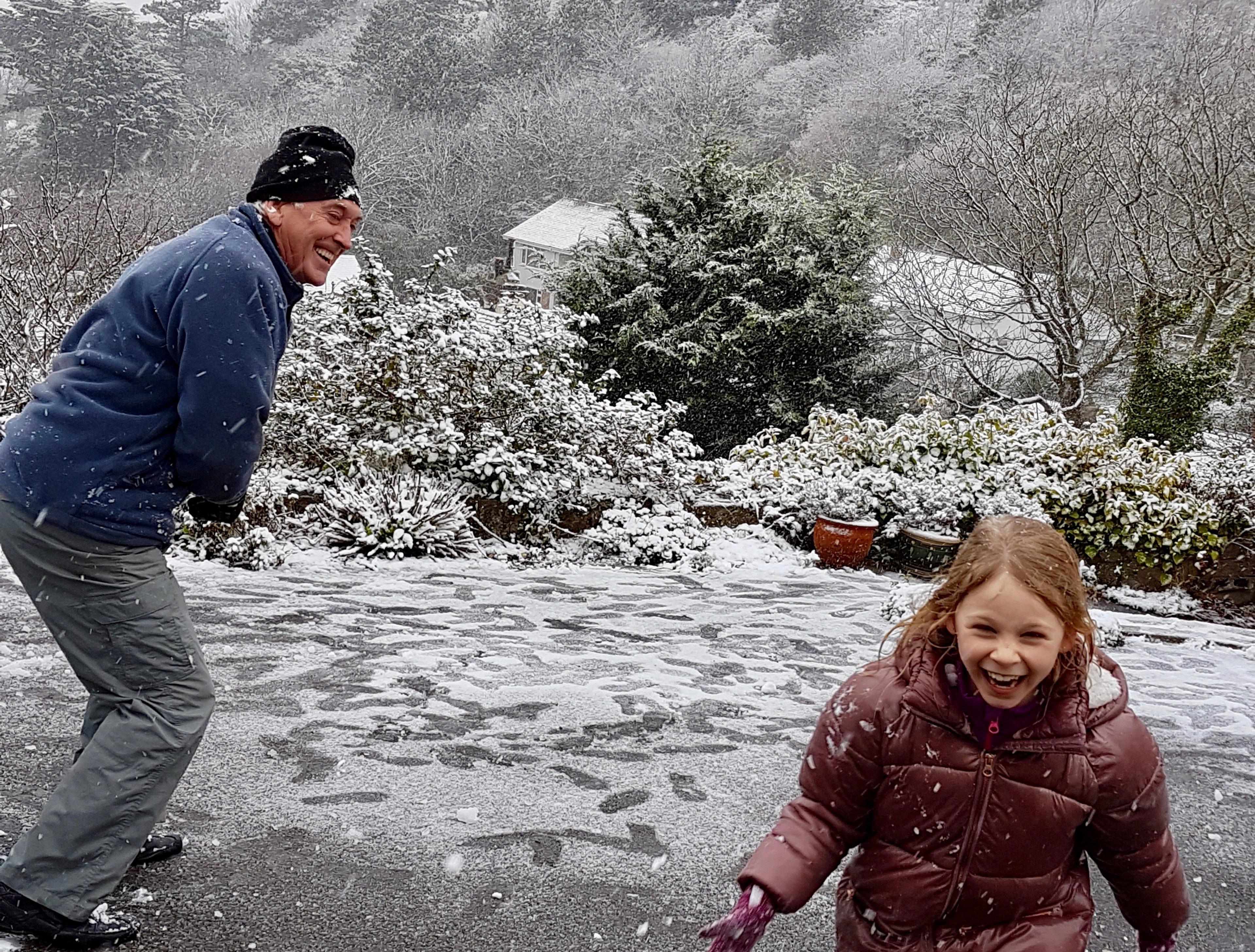 Lilya and Charles having a snowball fight