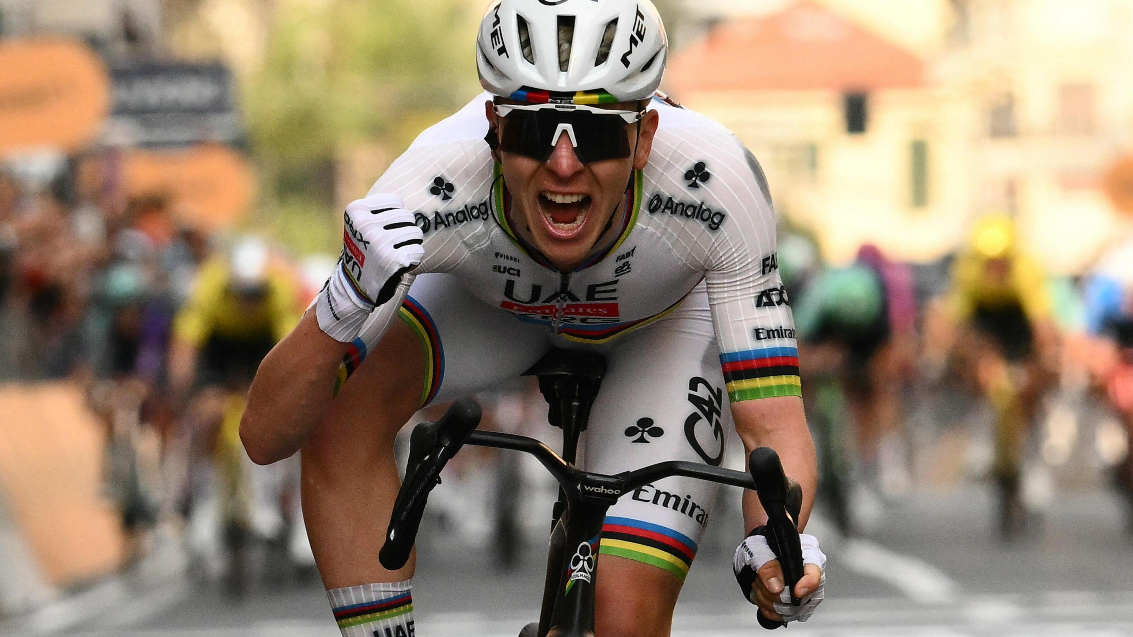World champion Tadej Pogacar roars in celebration after winning Milan-San Remo