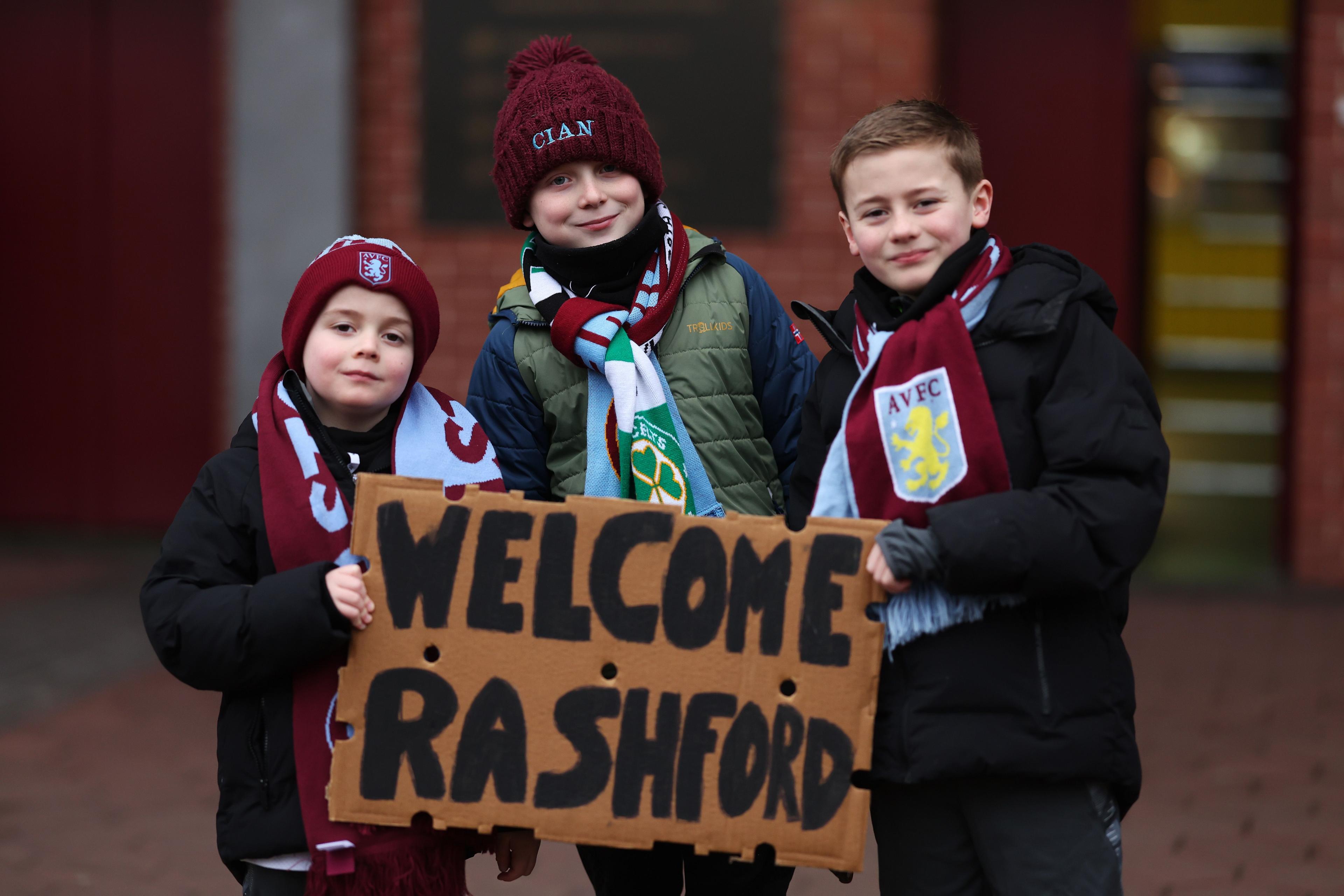 Young Villa fans pose for a photo outside the stadium, welcoming Marcus Rashford prior to the Emirates FA Cup Fourth Round match between Aston Villa and Tottenham Hotspur