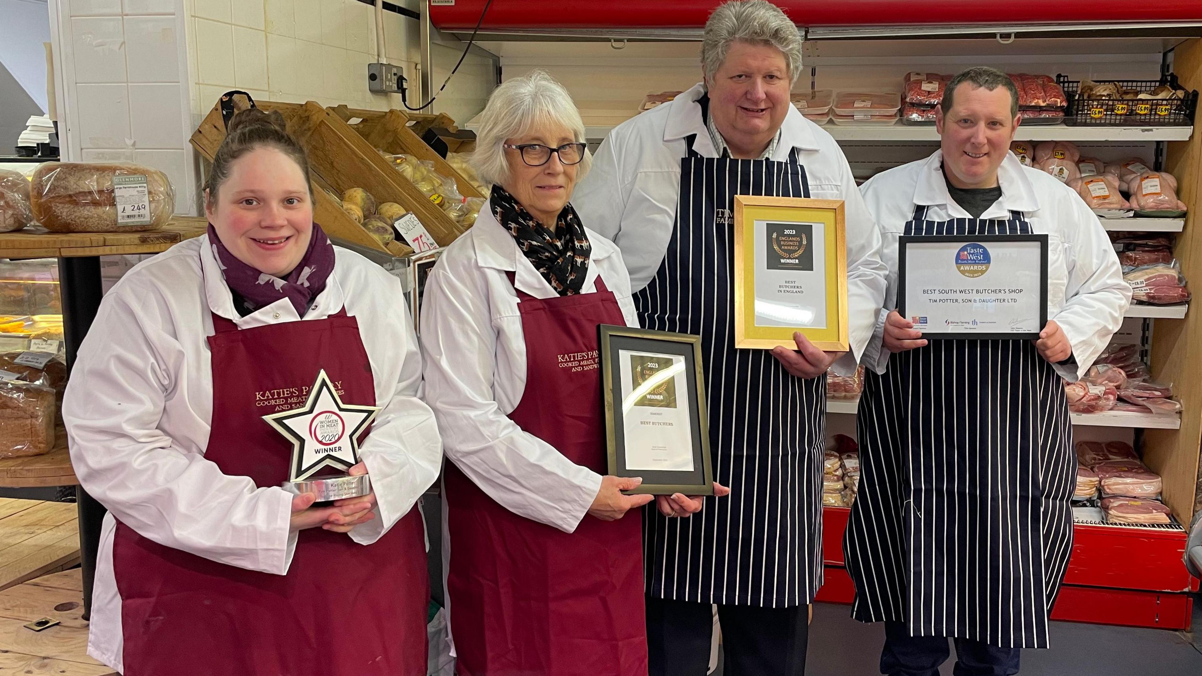 Katie Potter and the other staff holding their awards