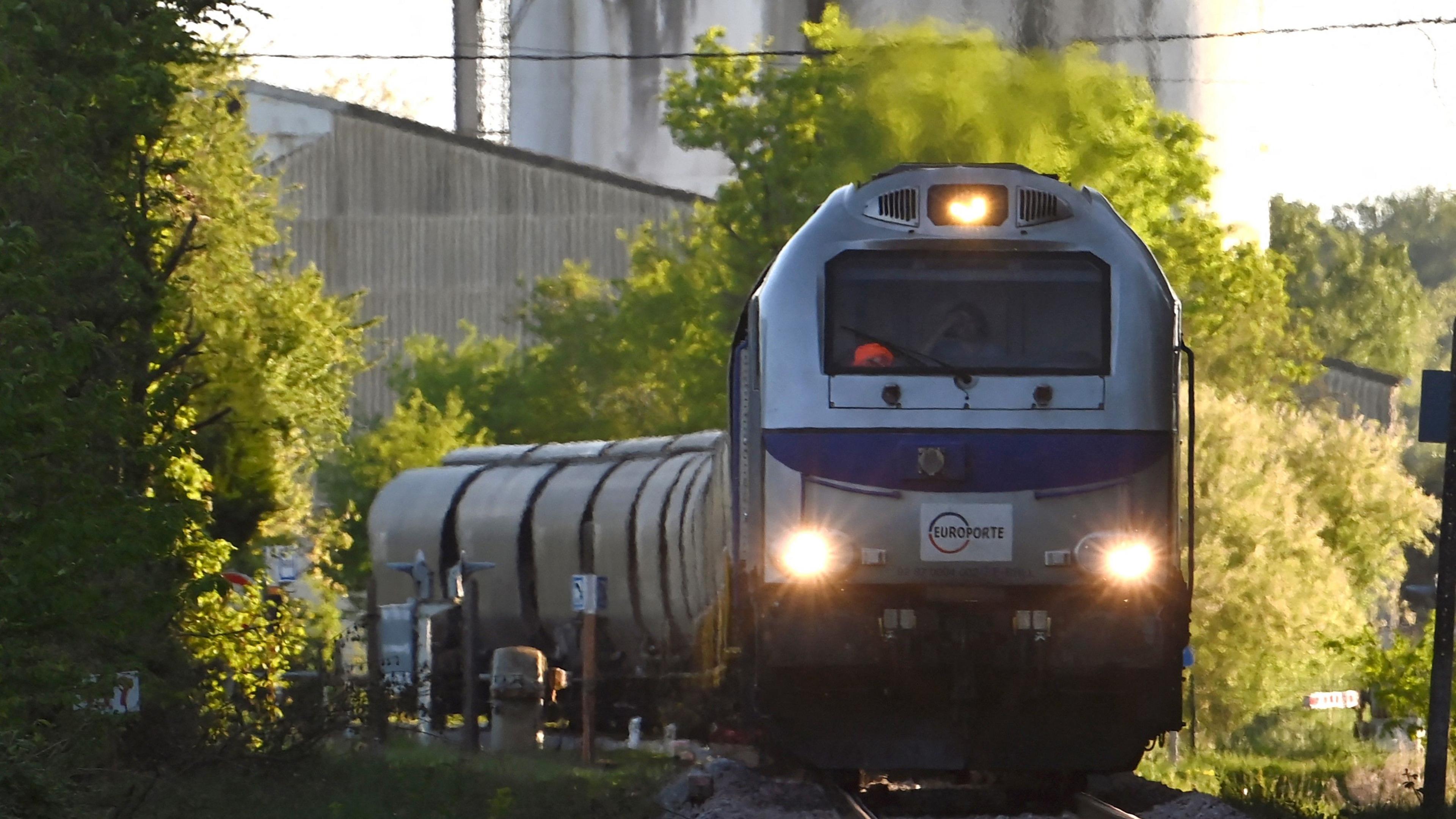 A French diesel train with headlights on approaches the camera.