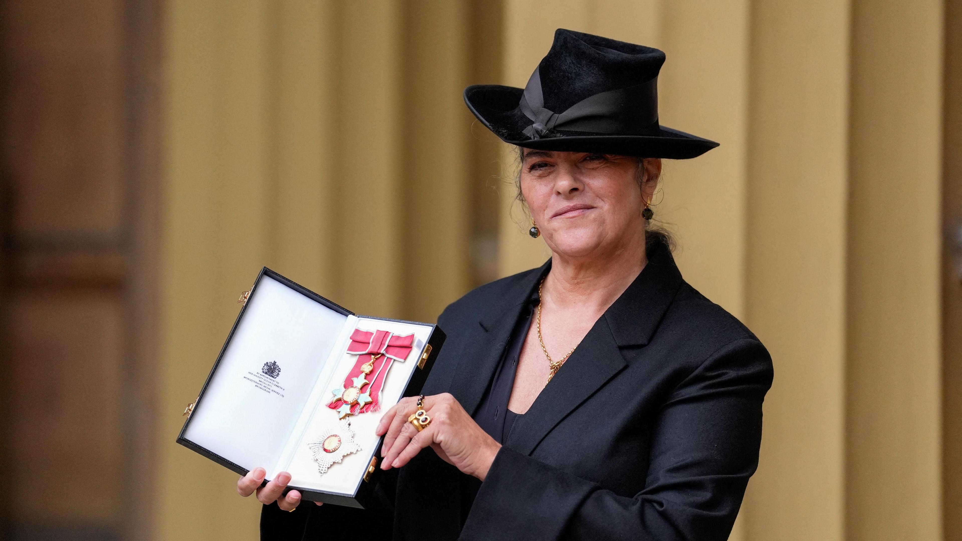 Artist Dame Tracey Emin poses for a photo after being made a Dame Commander at an Investiture ceremony at Buckingham Palace