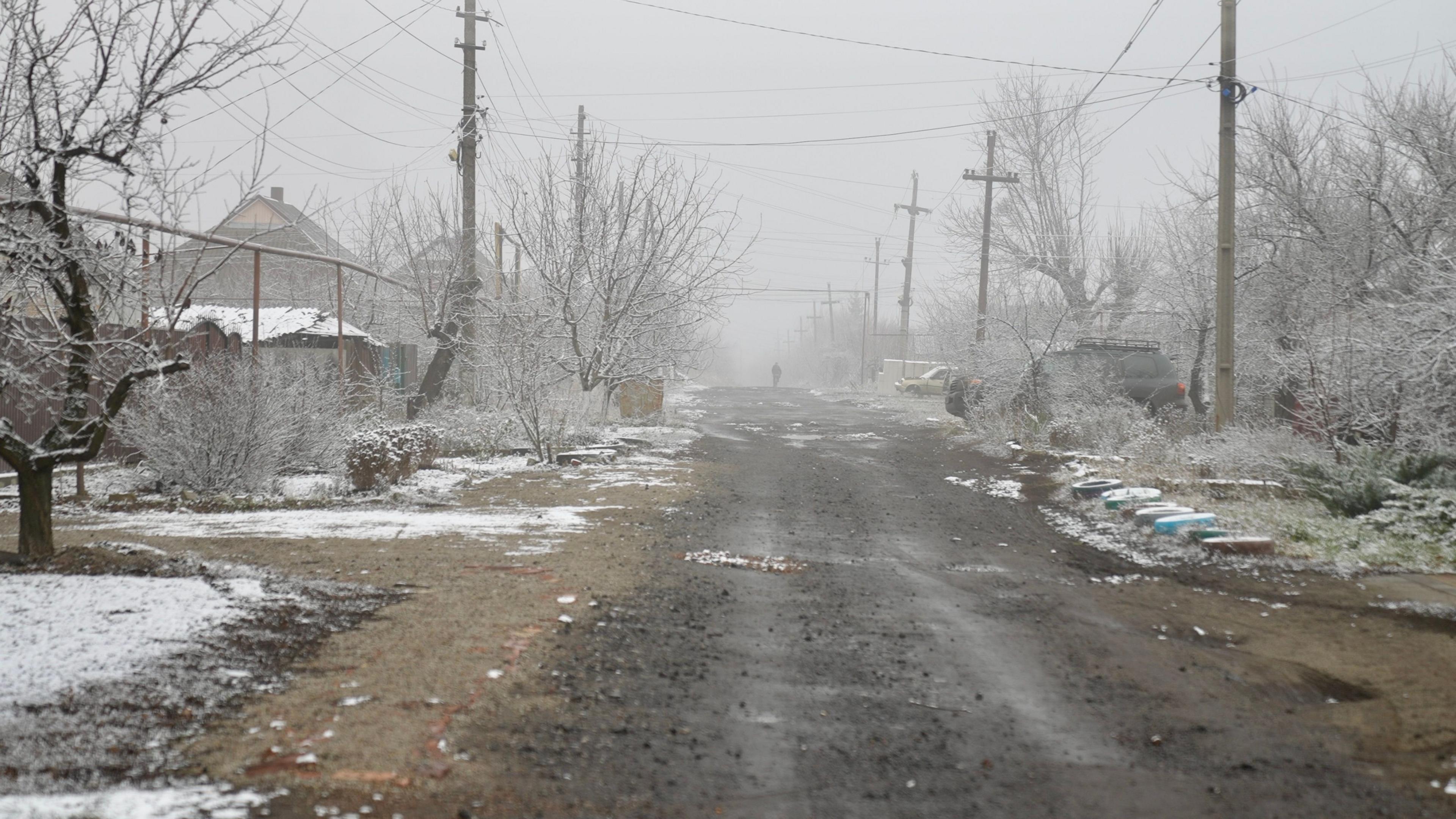 Empty residential street with snow on the ground in the city of Pokrovsk 