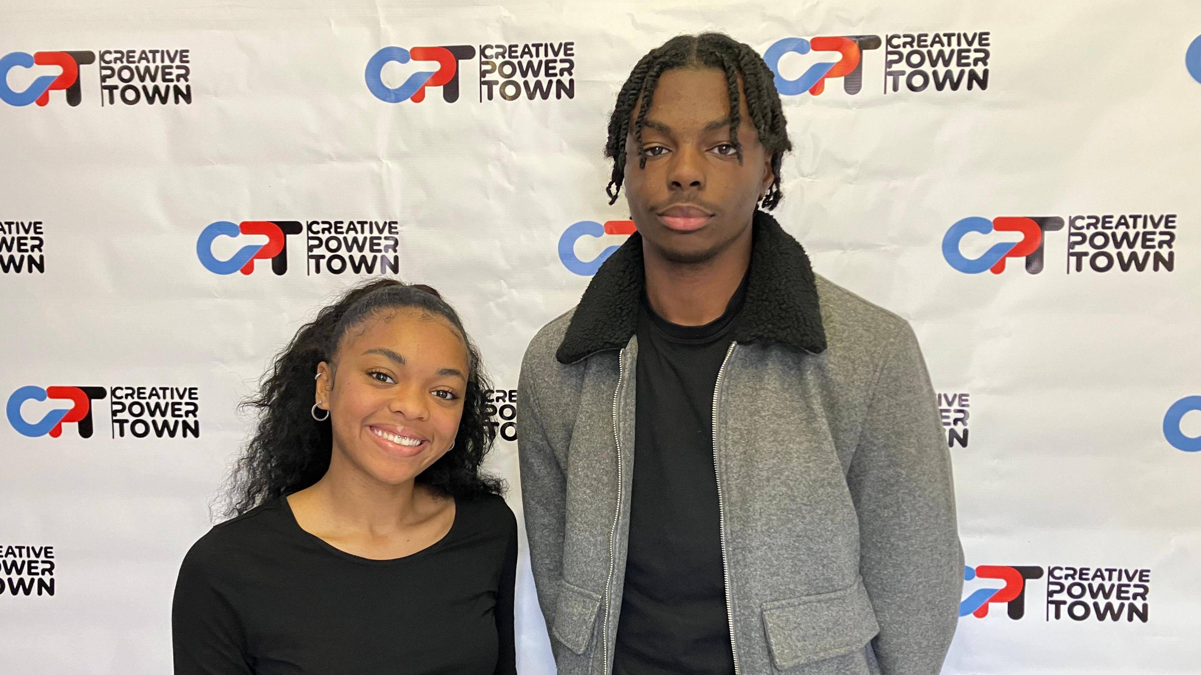 Teenagers Teja Dalphy and Tacari Jackson smiling straight at the camera