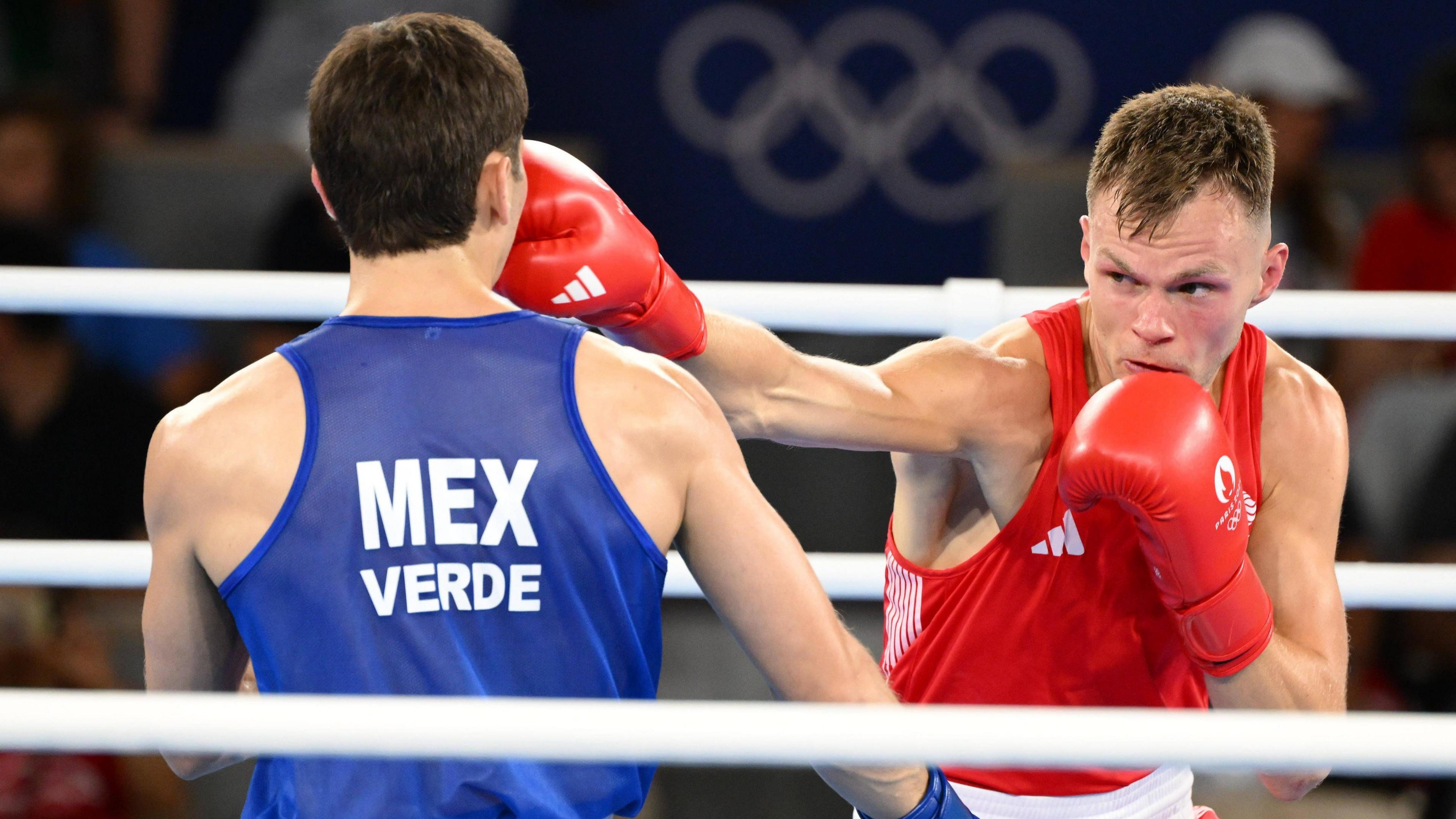 Lewis Richardson in the ring with Marco Verde at the Paris Olympics