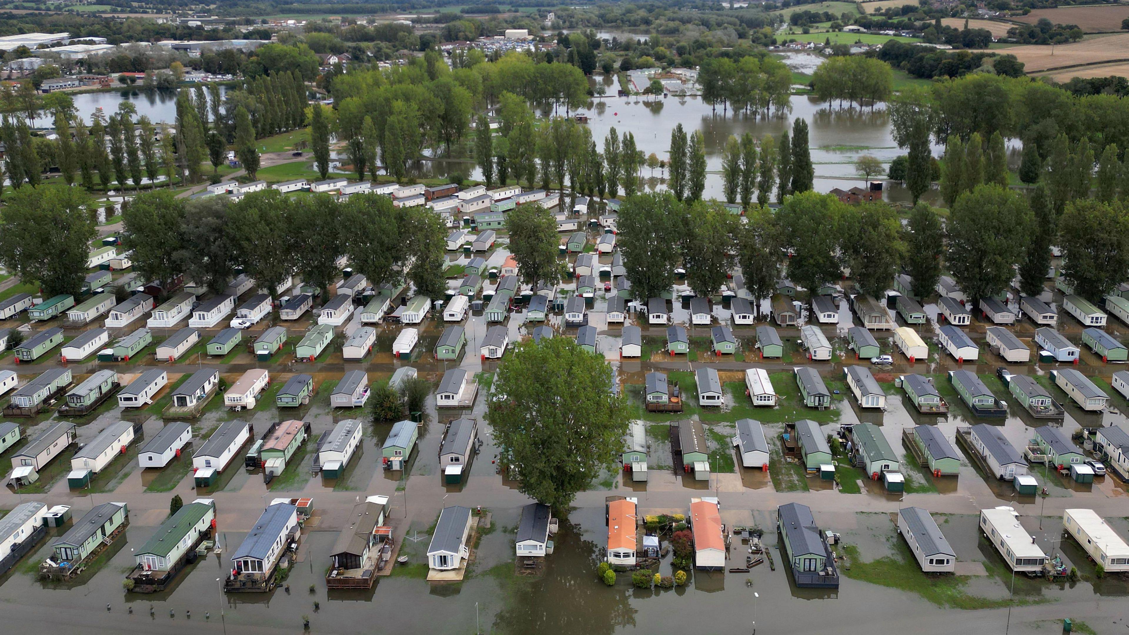 A drone image of caravans surrounded by floodwater