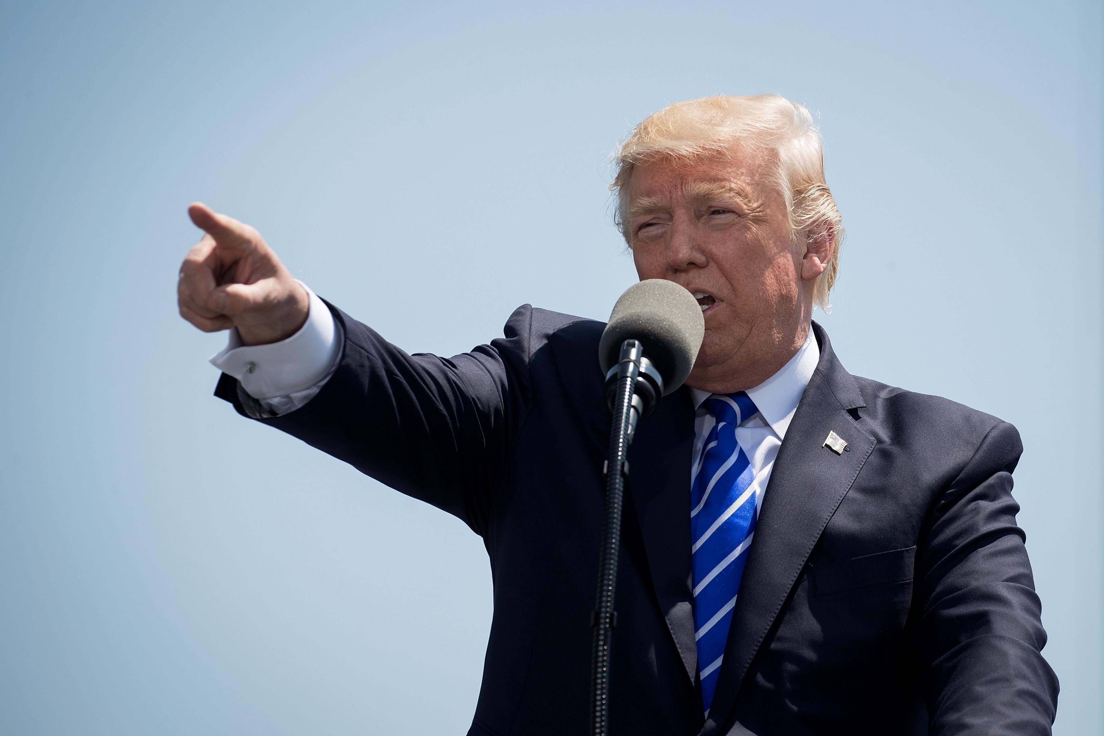 US President Donald Trump delivers the commencement address at the commencement ceremony at the U.S. Coast Guard Academy, May 17, 2017 in New London, Connecticut.