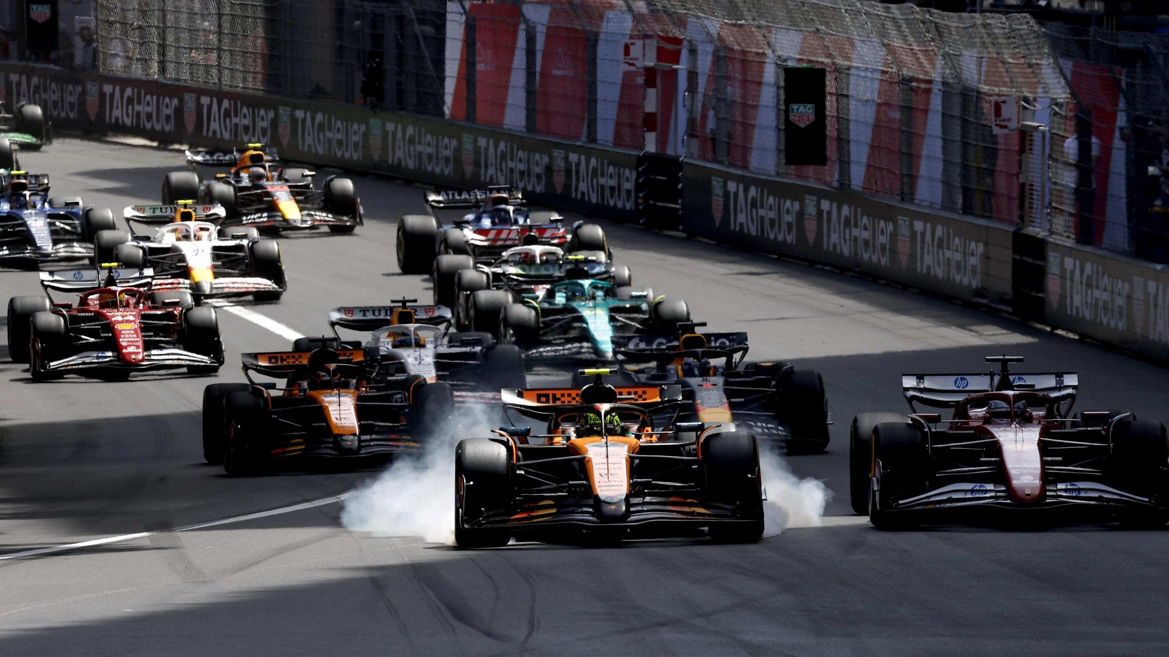 McLaren's Lando Norris locks up approaching the first corner of the Monaco Grand Prix