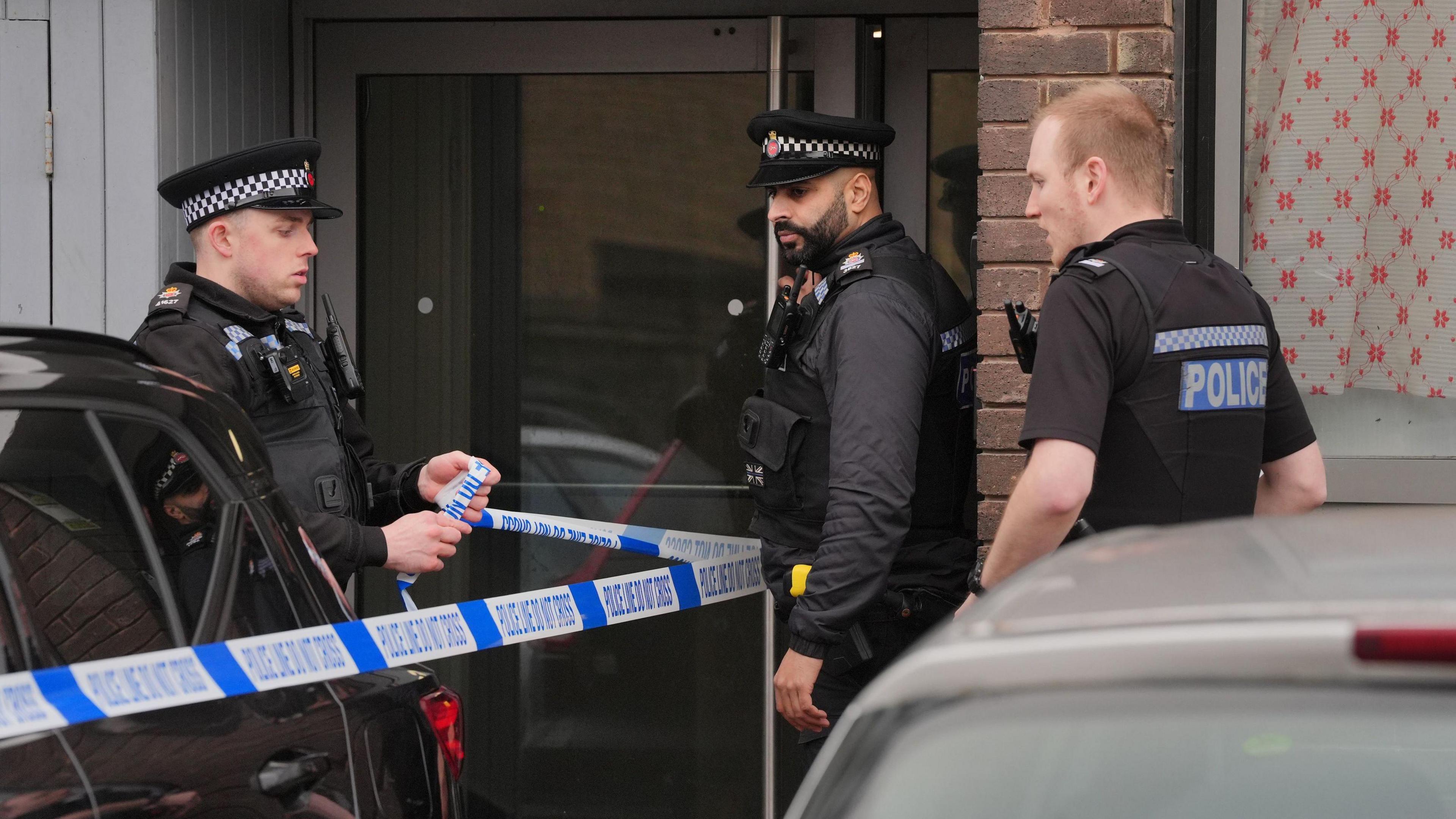 A police cordon in place at the scene at Imtech House on Woodthorpe Road in Ashford, Surrey.