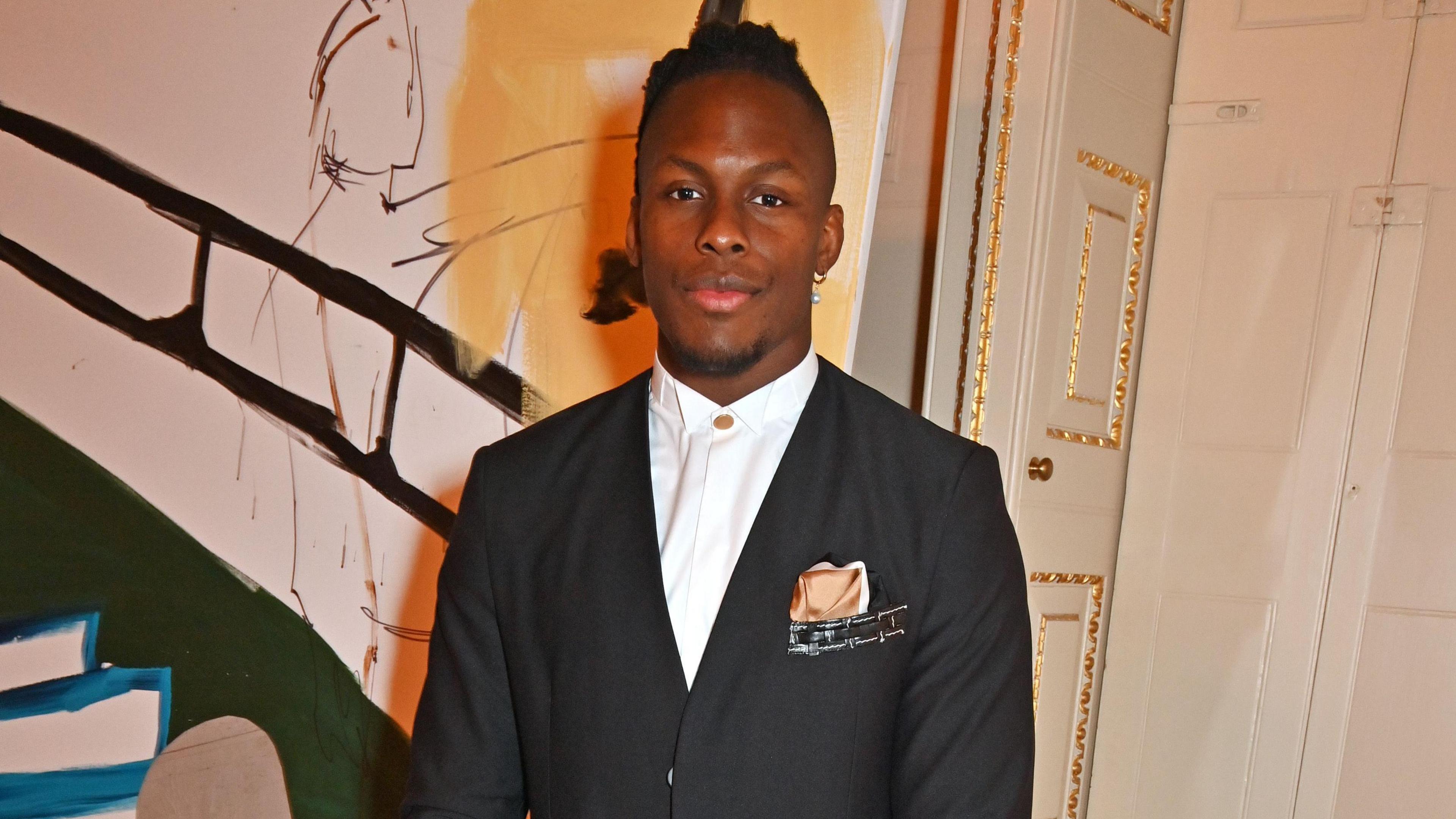 Maro Itoje at an art gallery opening