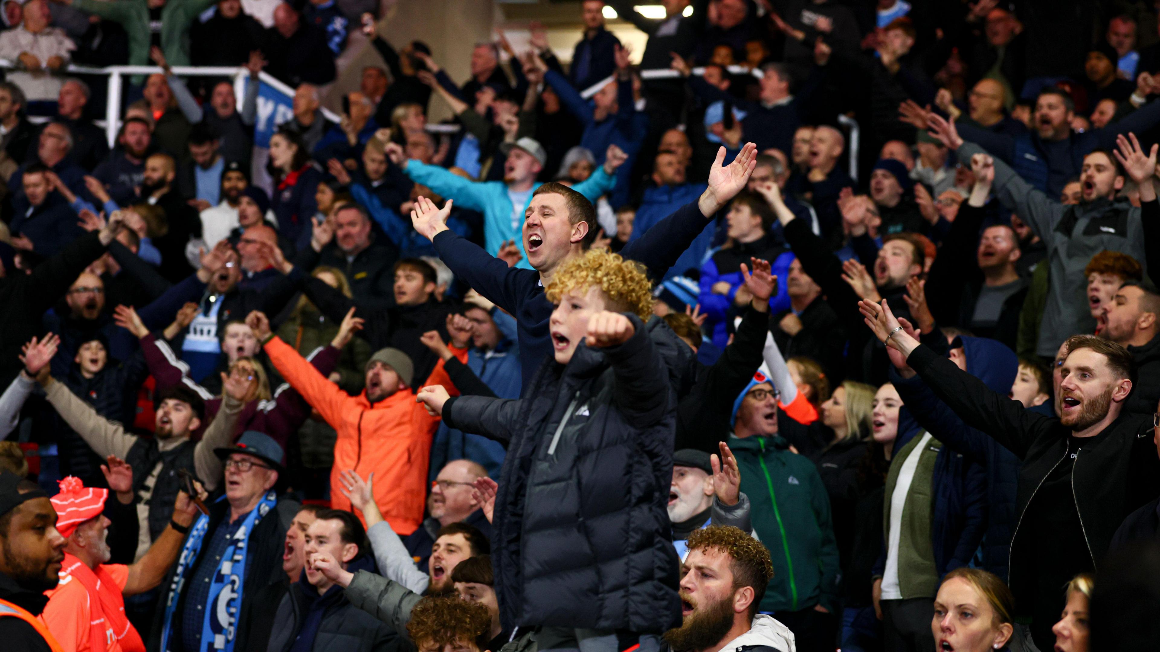 Coventry fans watching their team win at Stoke