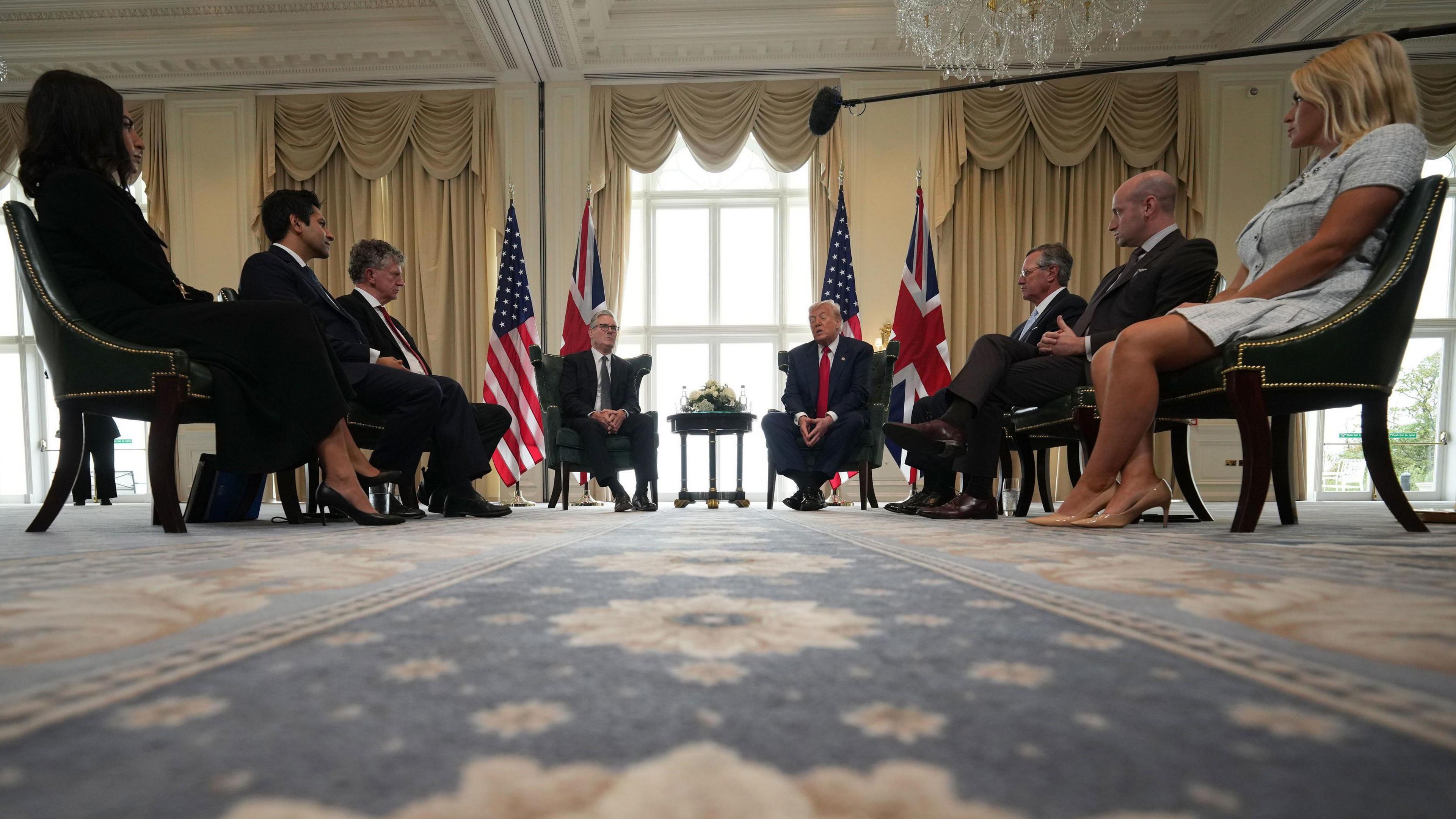 Prime Minister Sir Keir Starmer (centre left) during a meeting with US President Donald Trump (centre right) at Trump Turnberry golf course in South Ayrshire, flanked by three officials, including US Ambassador Warren Stephens and White House deputy chief of staff Stephen Miller, seated on each side. 