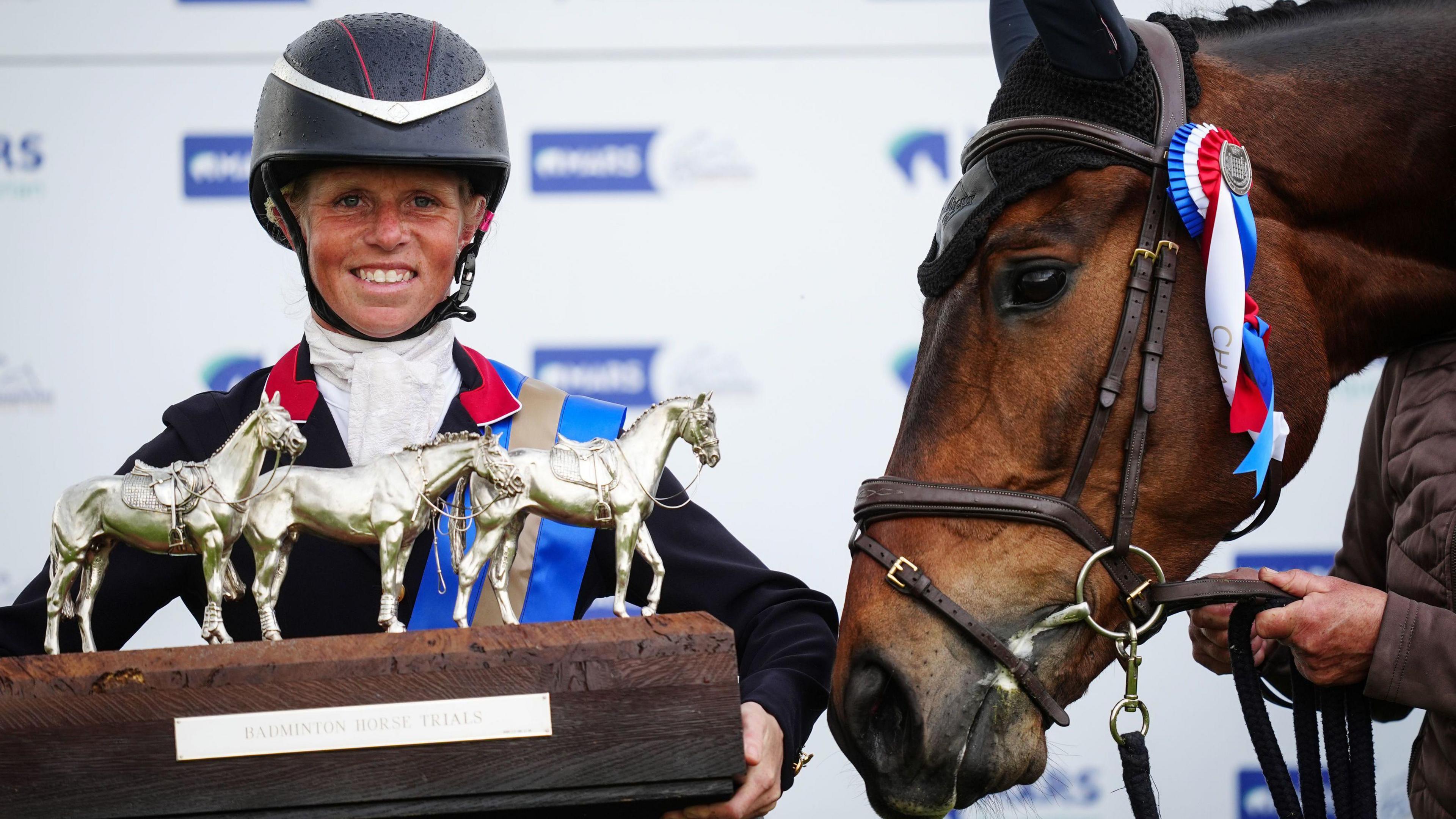 British rider Ros Canter celebrates with the Badminton Horse Trials trophy after winning on her horse Lordships Graffalo