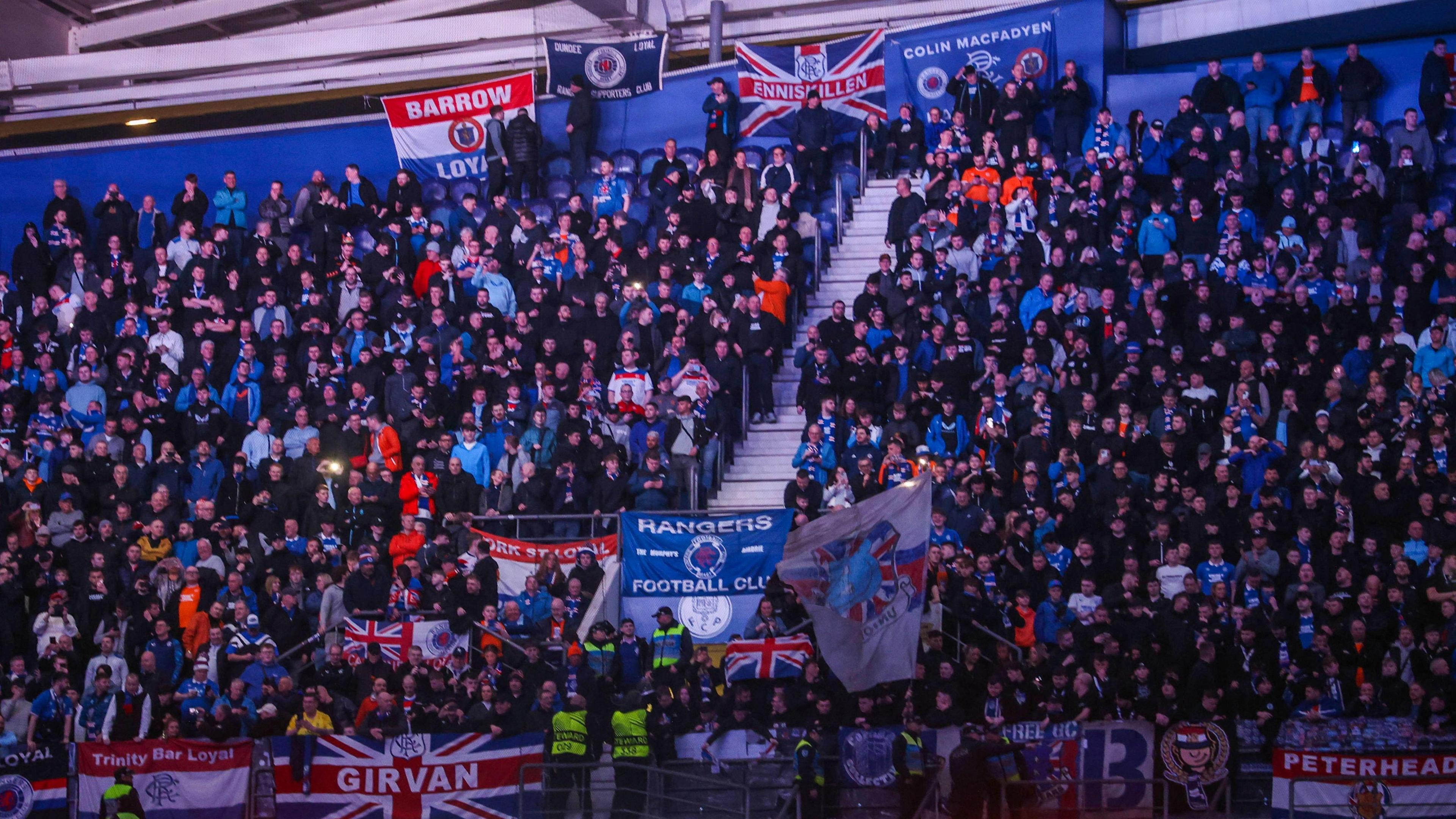Rangers fans at the Estadio do Dragao, with a number of flags visible among the crowd