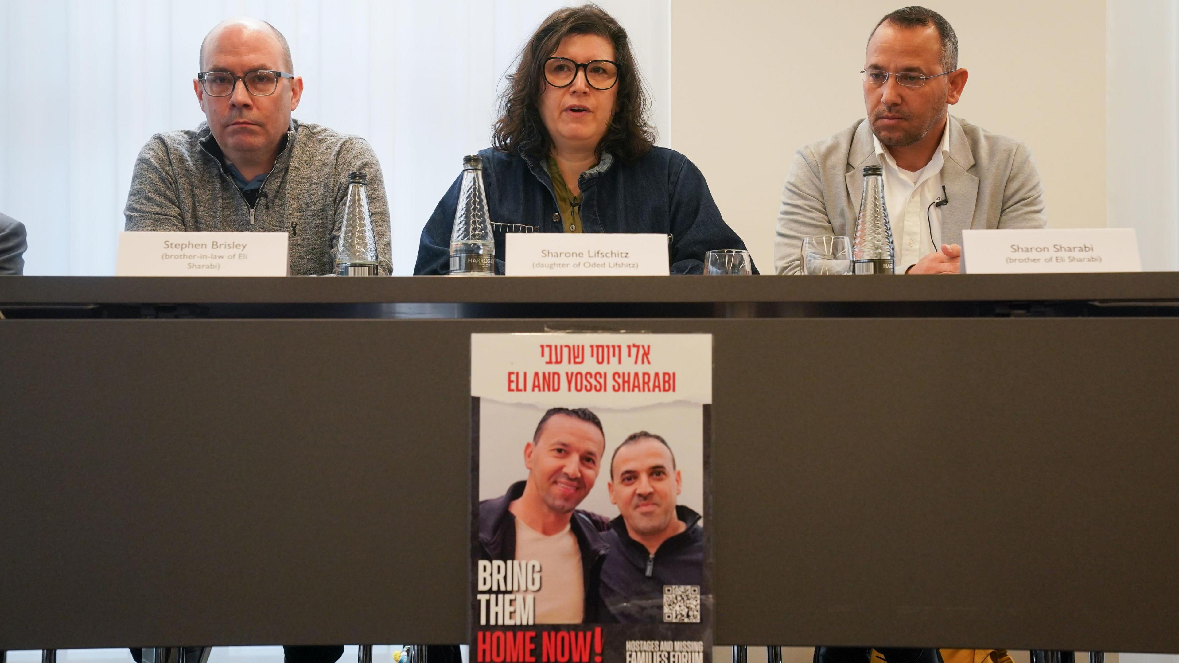 Stephen Brisley, Sharone Lifschitz, Sharon Sharabi who are family members of four people taken hostage by Hamas in Israel on October 7, speak during a press conference at the office of Mishcon de Reya in London