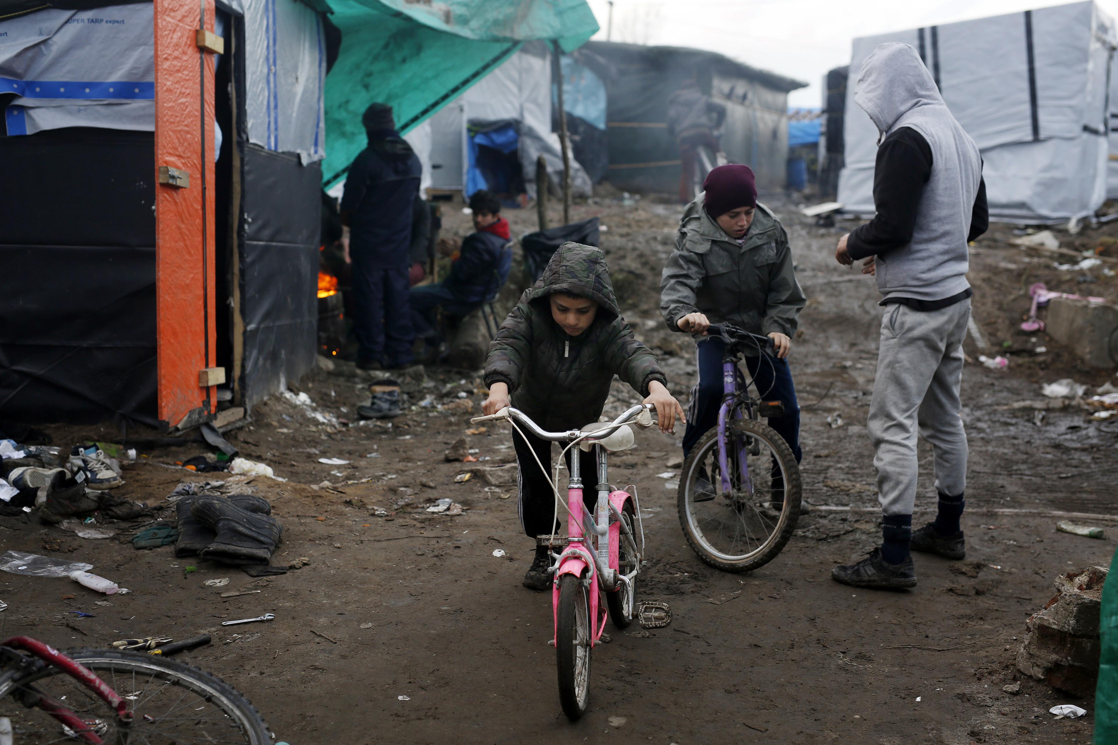 Child riding bike in the camp