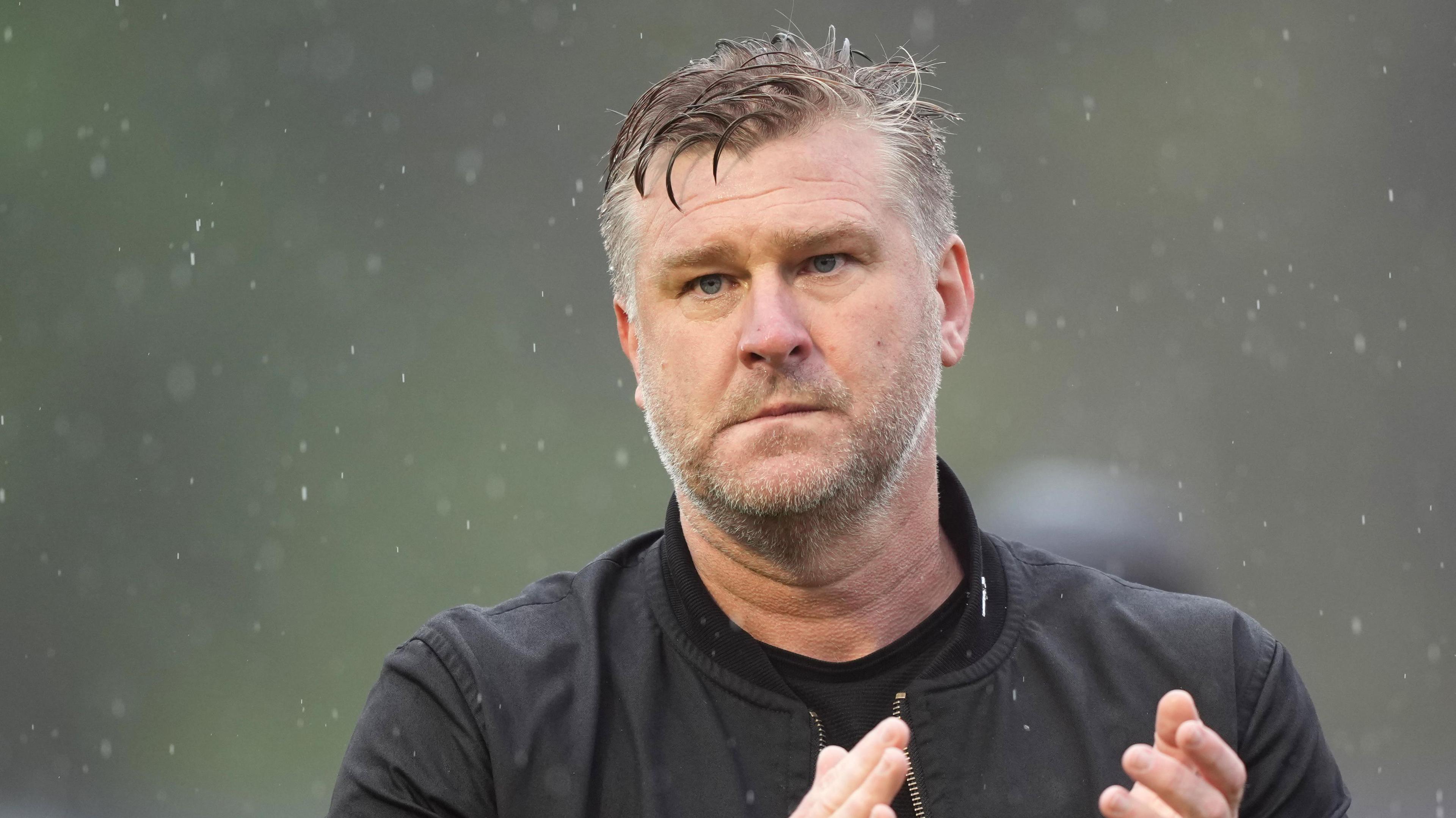 Salford City boss Karl Robinson applauds his side