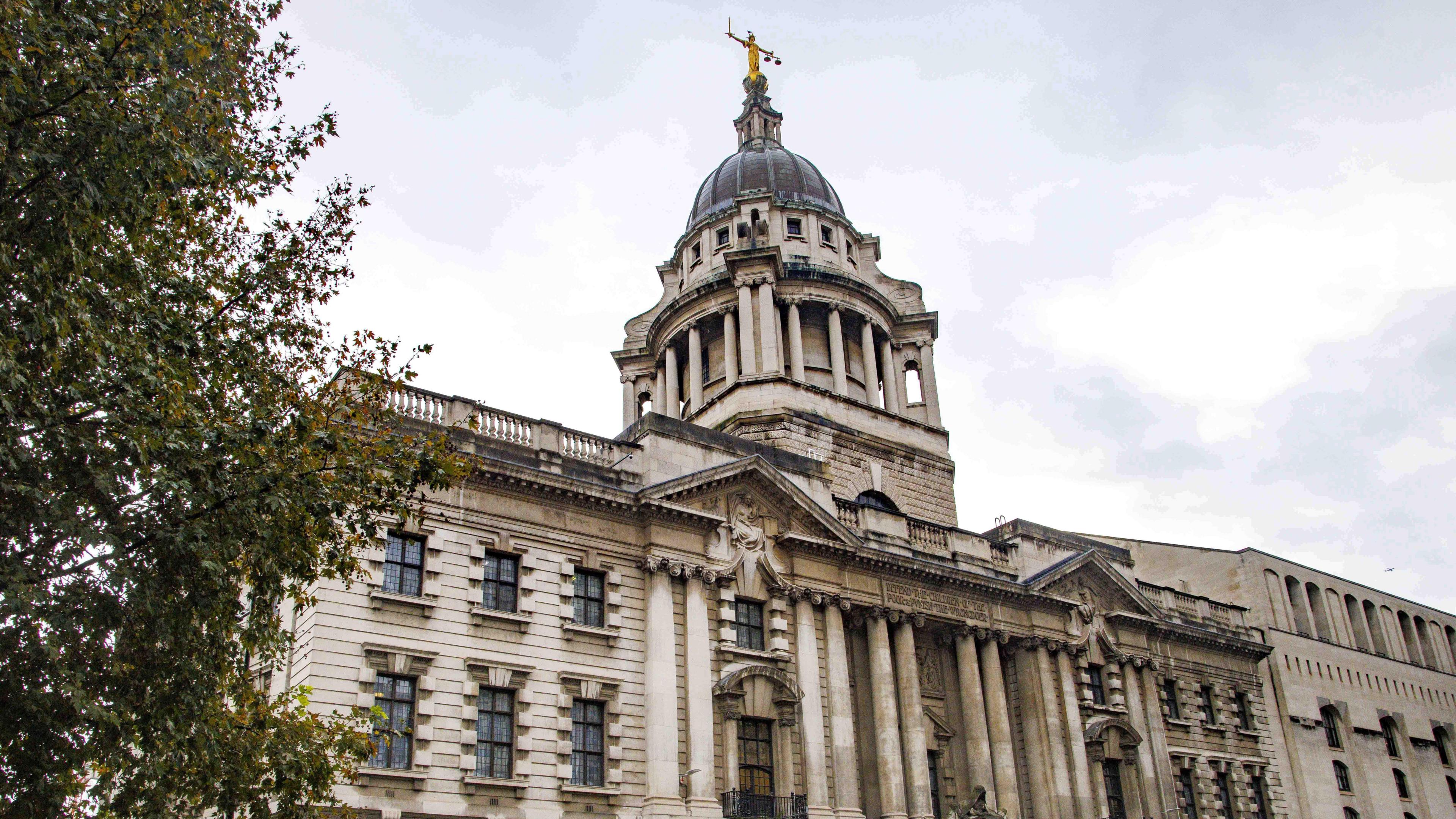 Exterior of central Criminal Court with Lady Justice atop