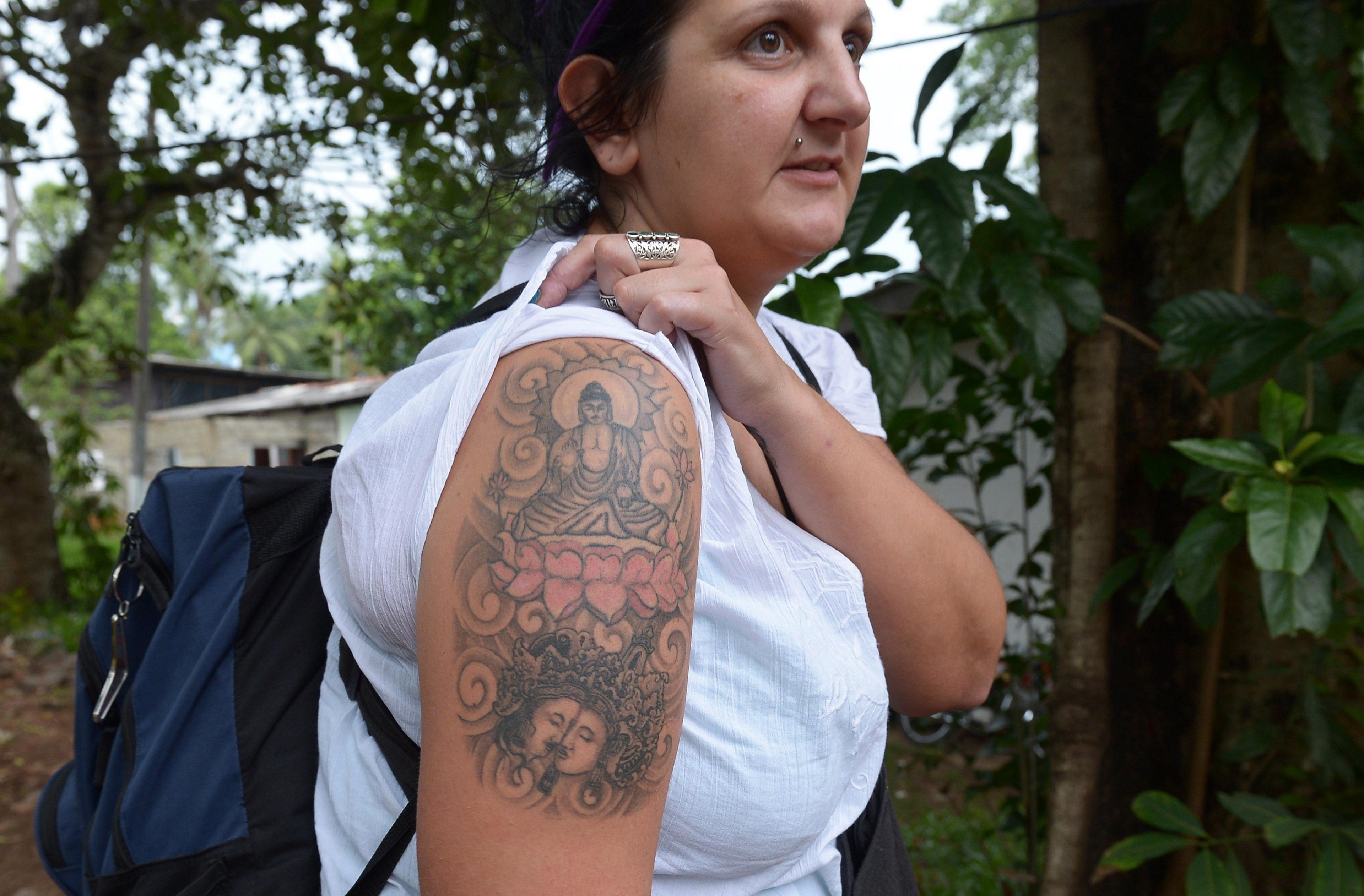 British tourist Naomi Coleman with her Buddha tattoo