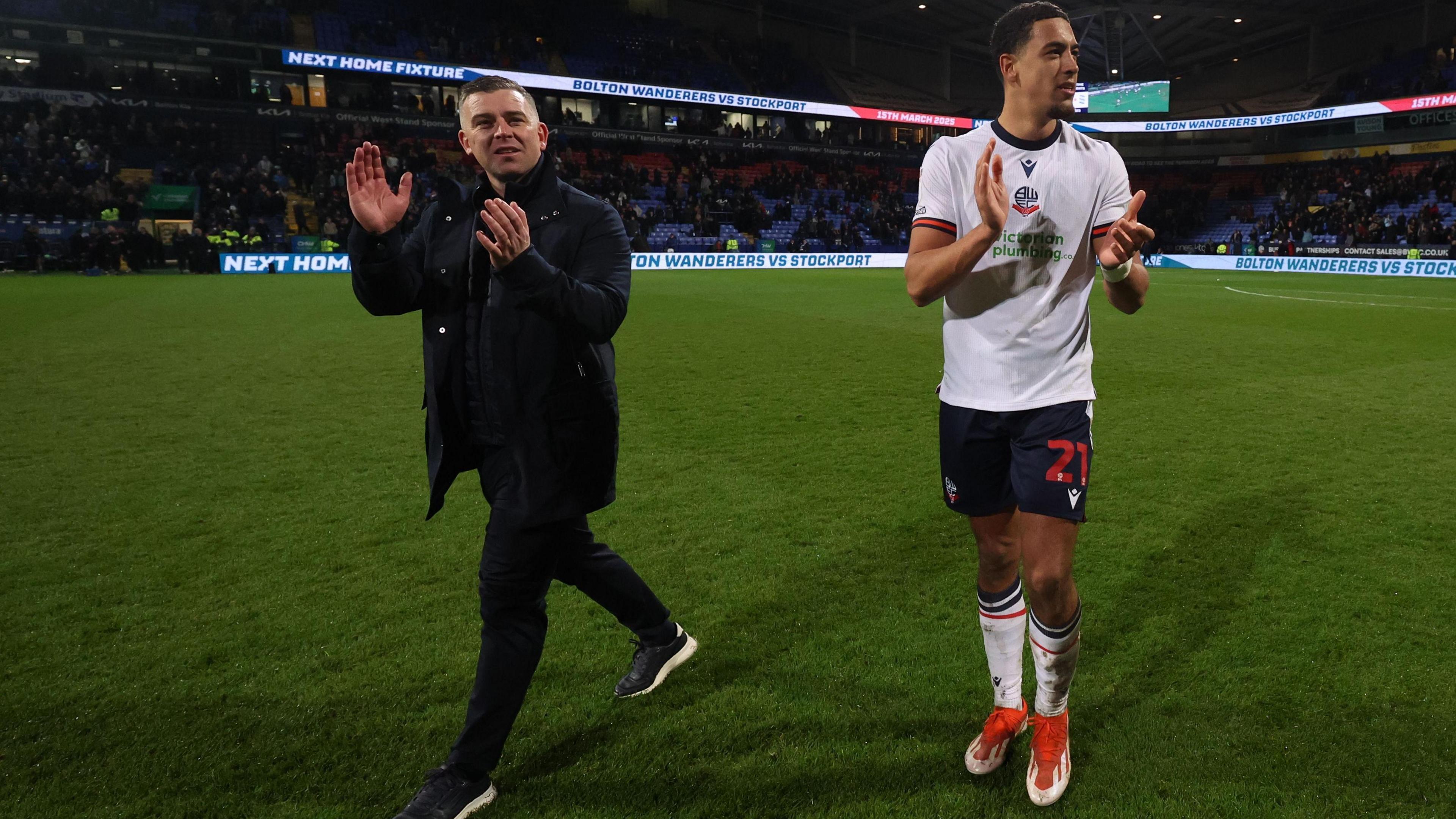 Bolton boss Steven Schumacher claps the fans after the 3-1 win over Birmingham on 4 March