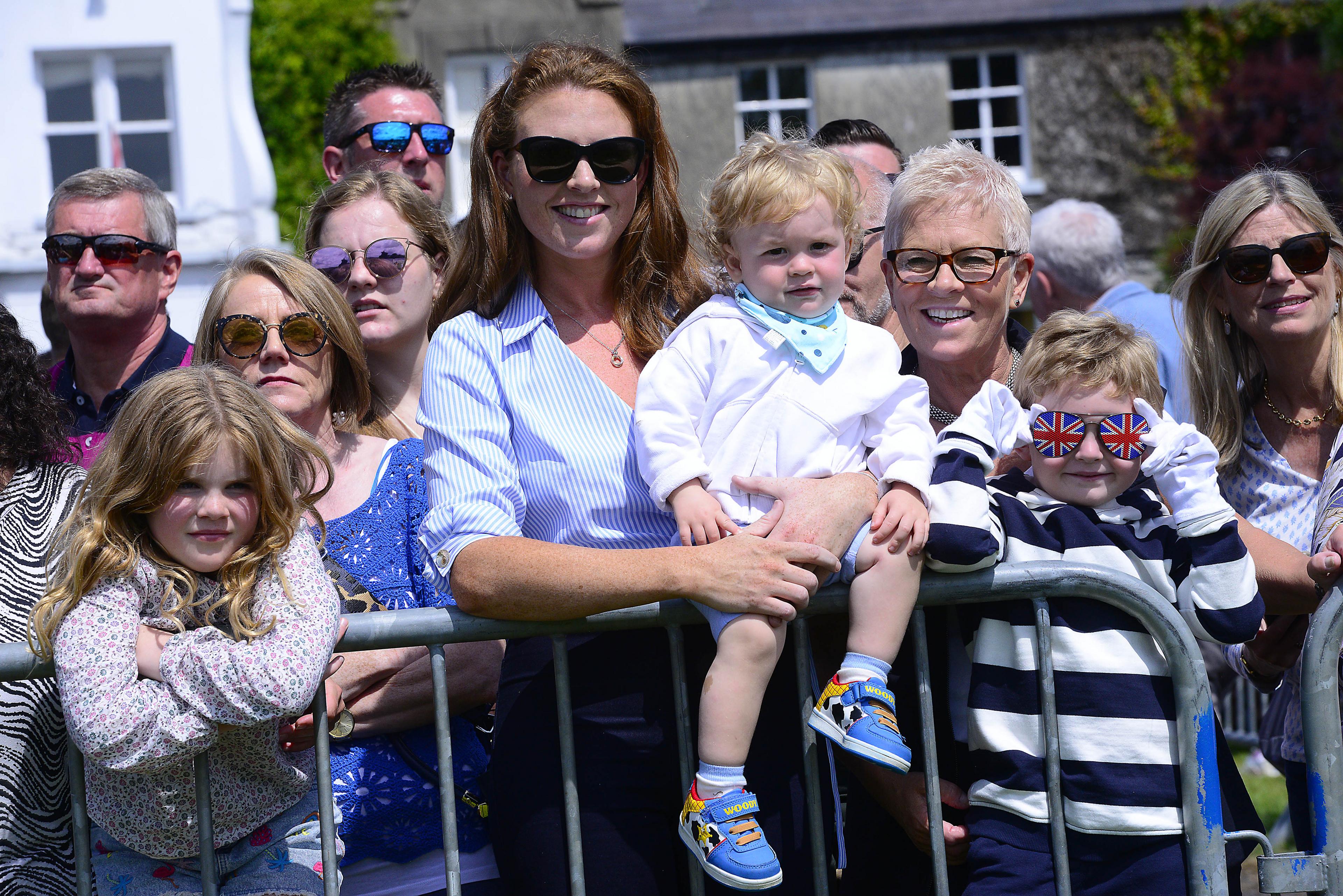 Onlookers watch as the parade goes by