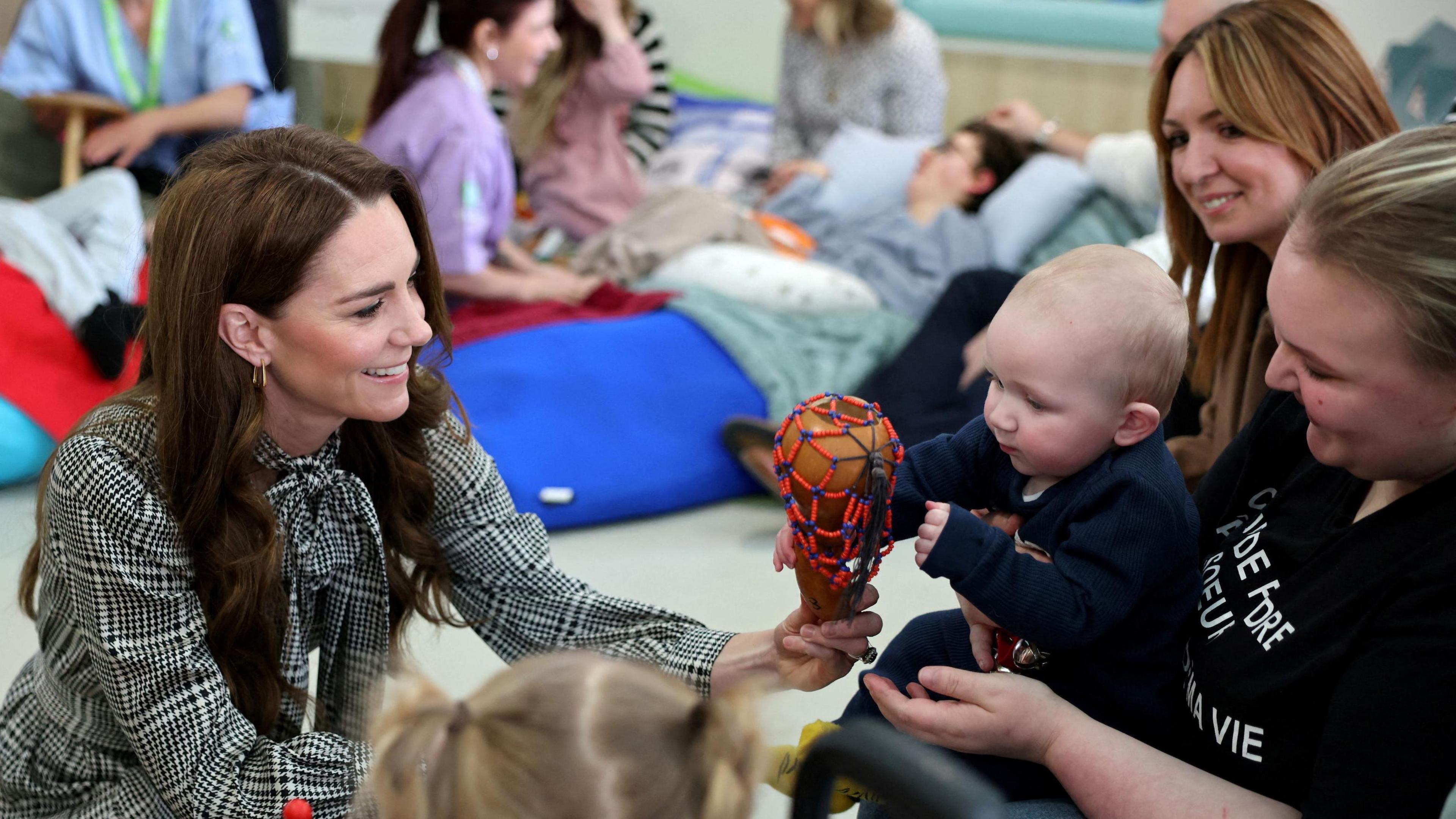 Princess of Wales playing with children at a children's hospice in Cardiff, Wales