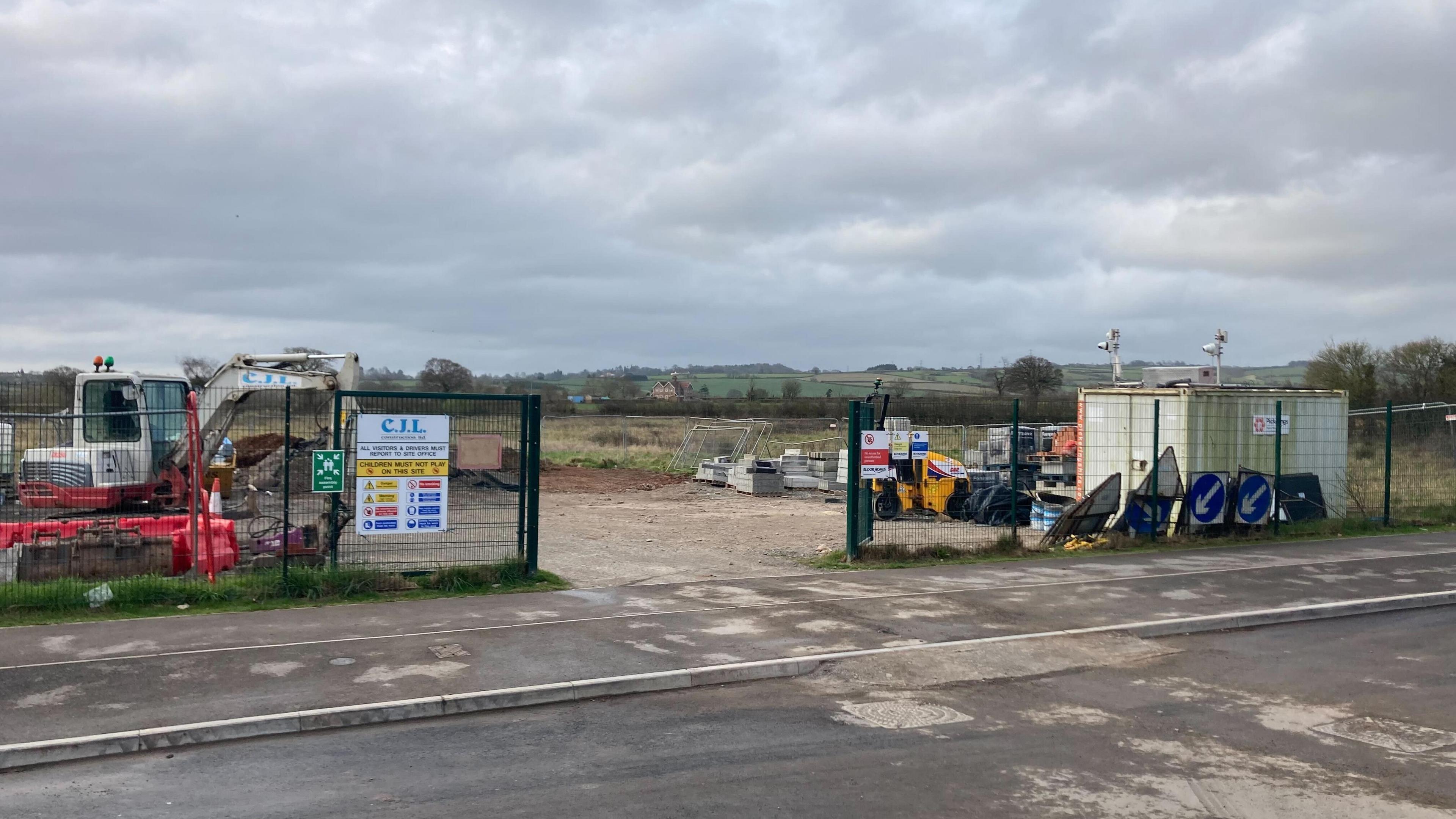Picture of a digger and building materials at the proposed site of new Wilstock Primary School on Cosmos Drive in Bridgwater