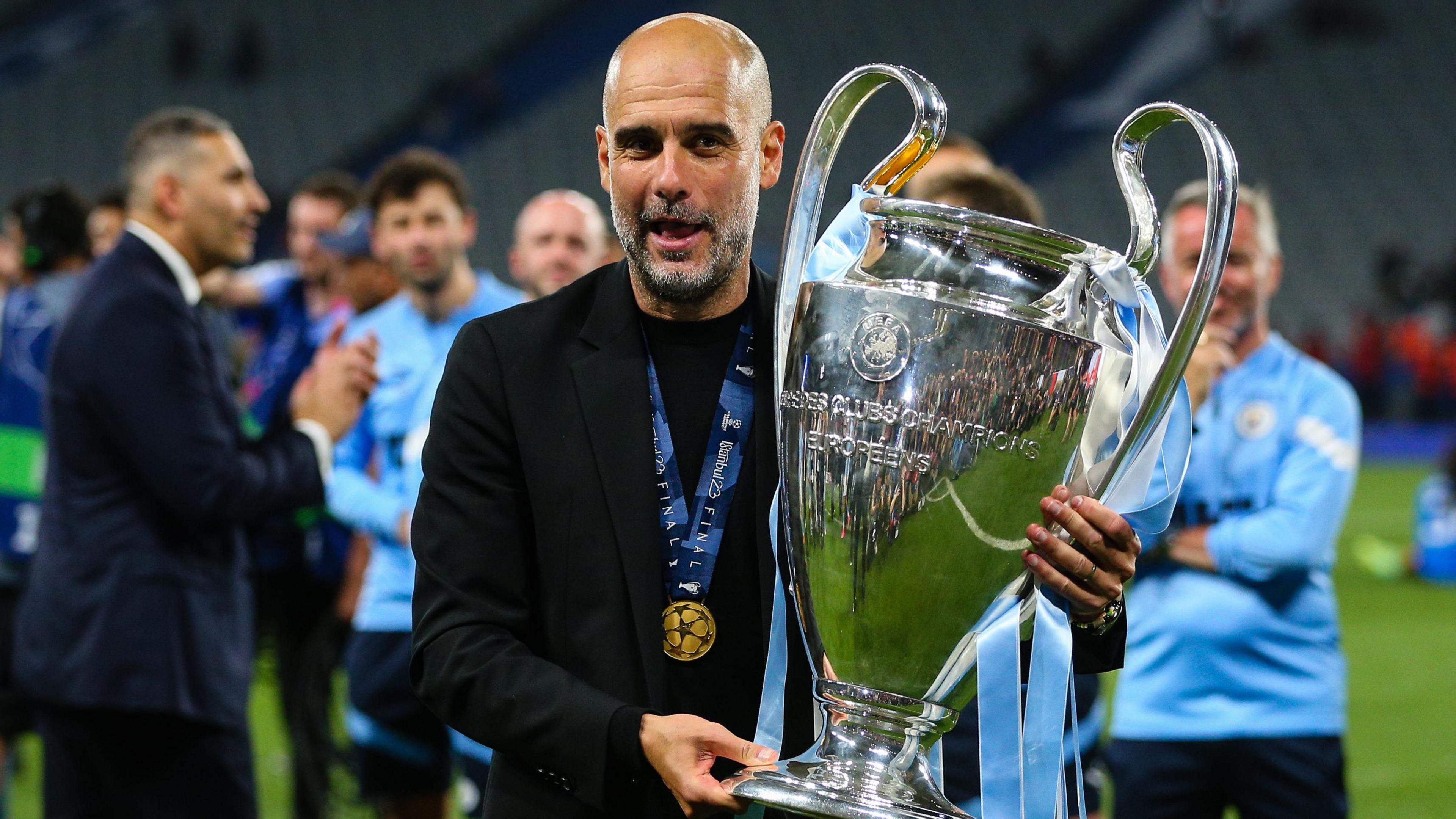 Pep Guardiola with the Champions League trophy after Manchester City beat Inter Milan in the 2023 final