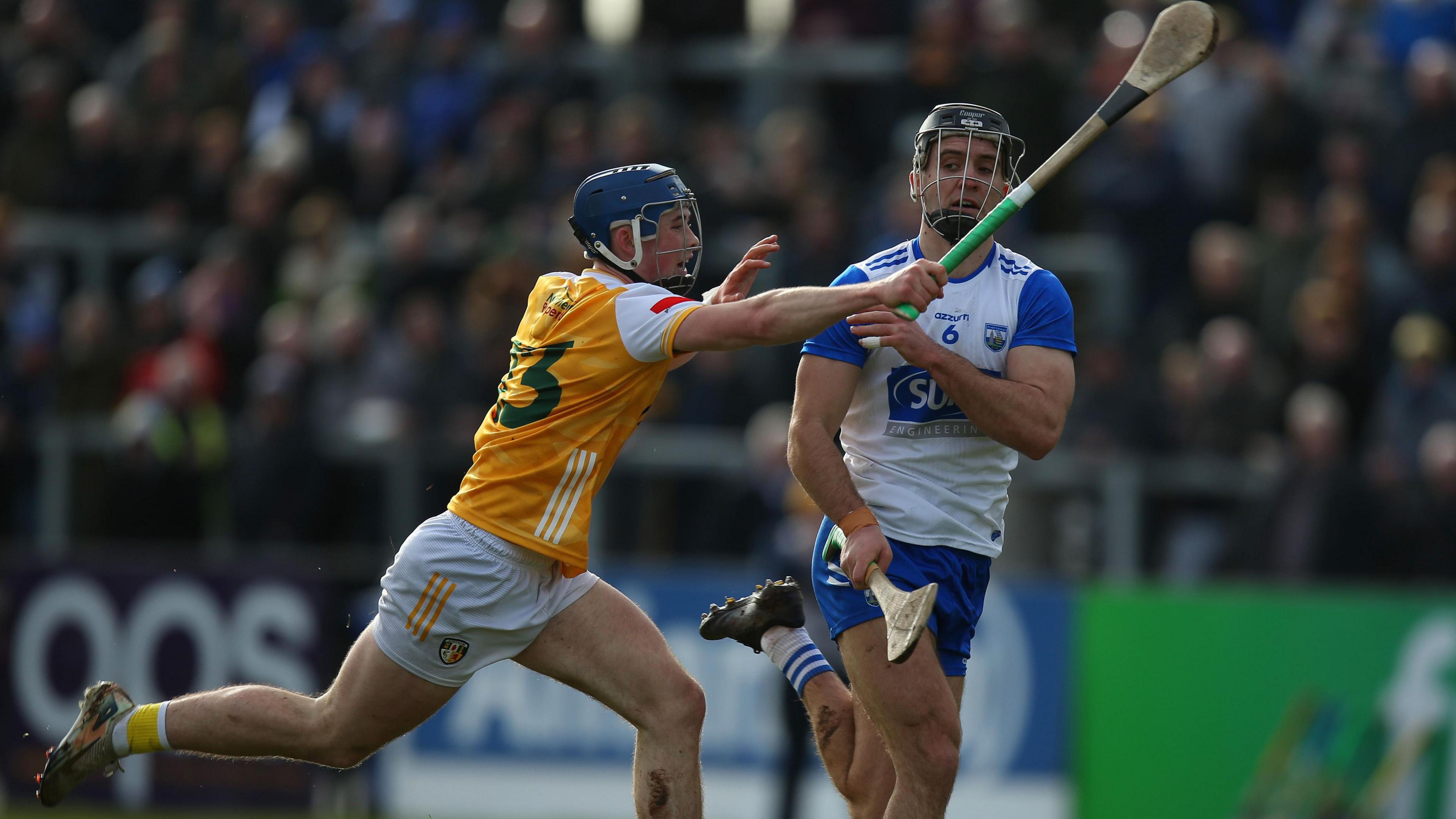 Antrim's Joseph McLaughlin attempts to take pace with Waterford centre half-back Mark Fitzgerald