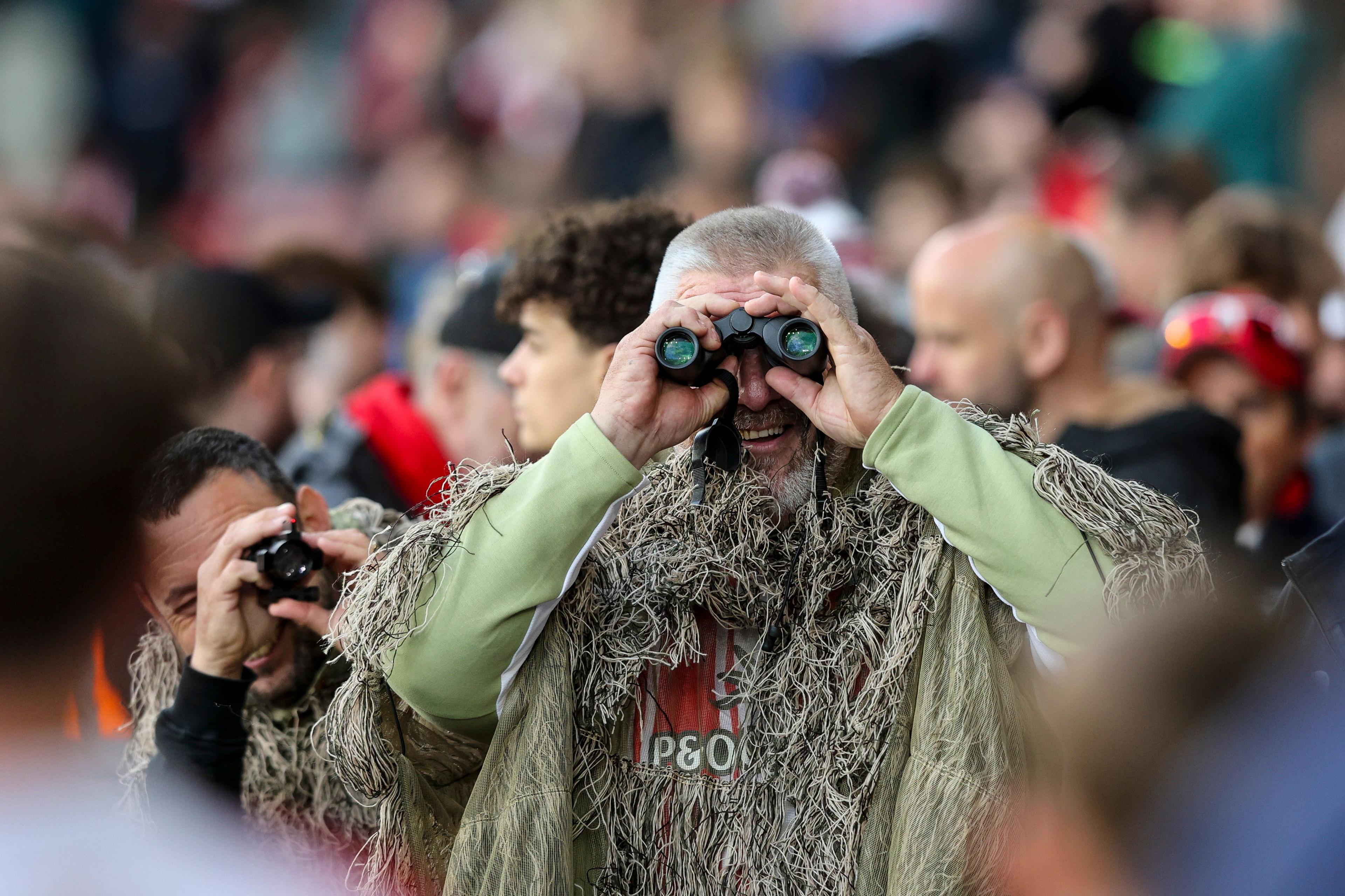 A Southampton fan in camouflage attire during the second leg of his side's Championship semi-final against Middlesbrough
