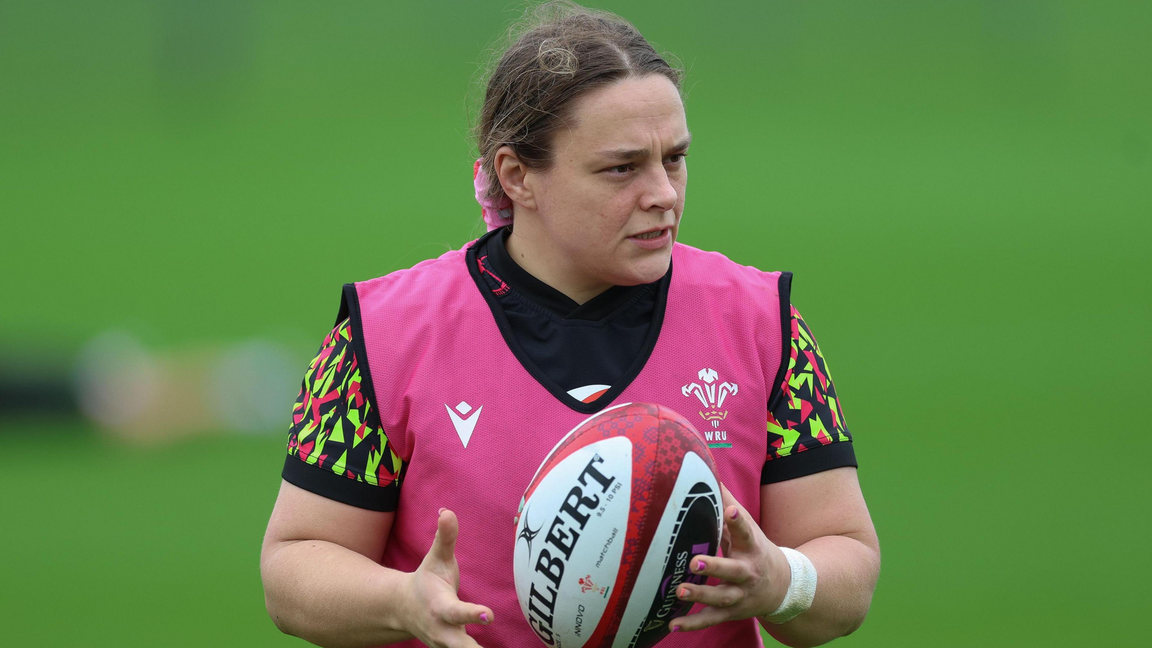 Jenni Scoble holds a ball in training with Wales