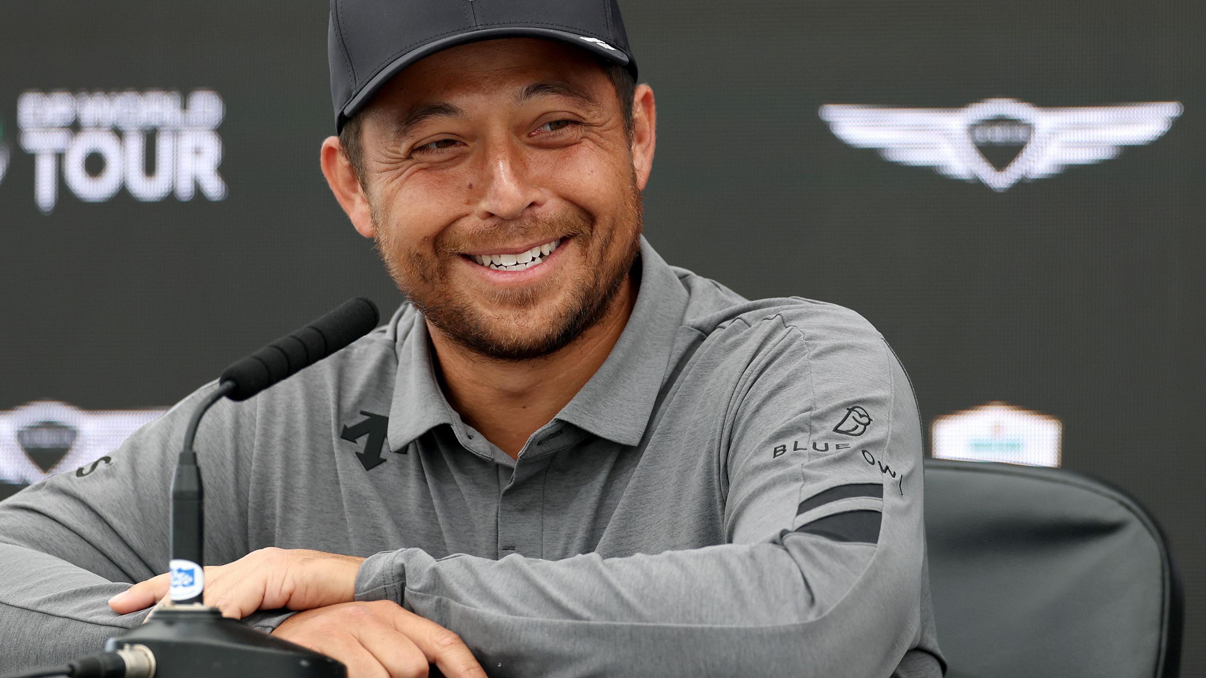 Xander Schauffele smiling while talking to the media at the Scottish Open
