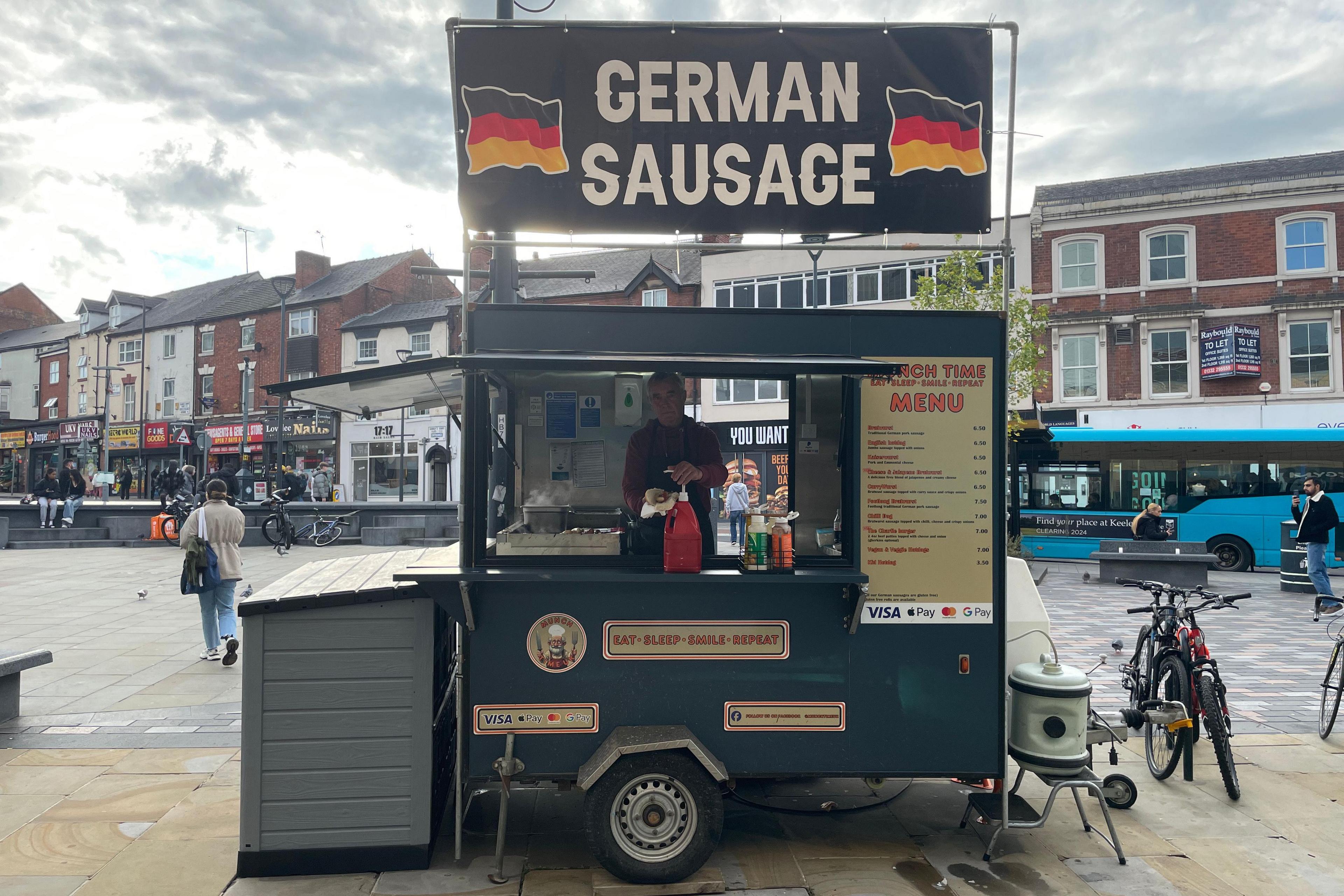 Charlie selling sausages from his stall