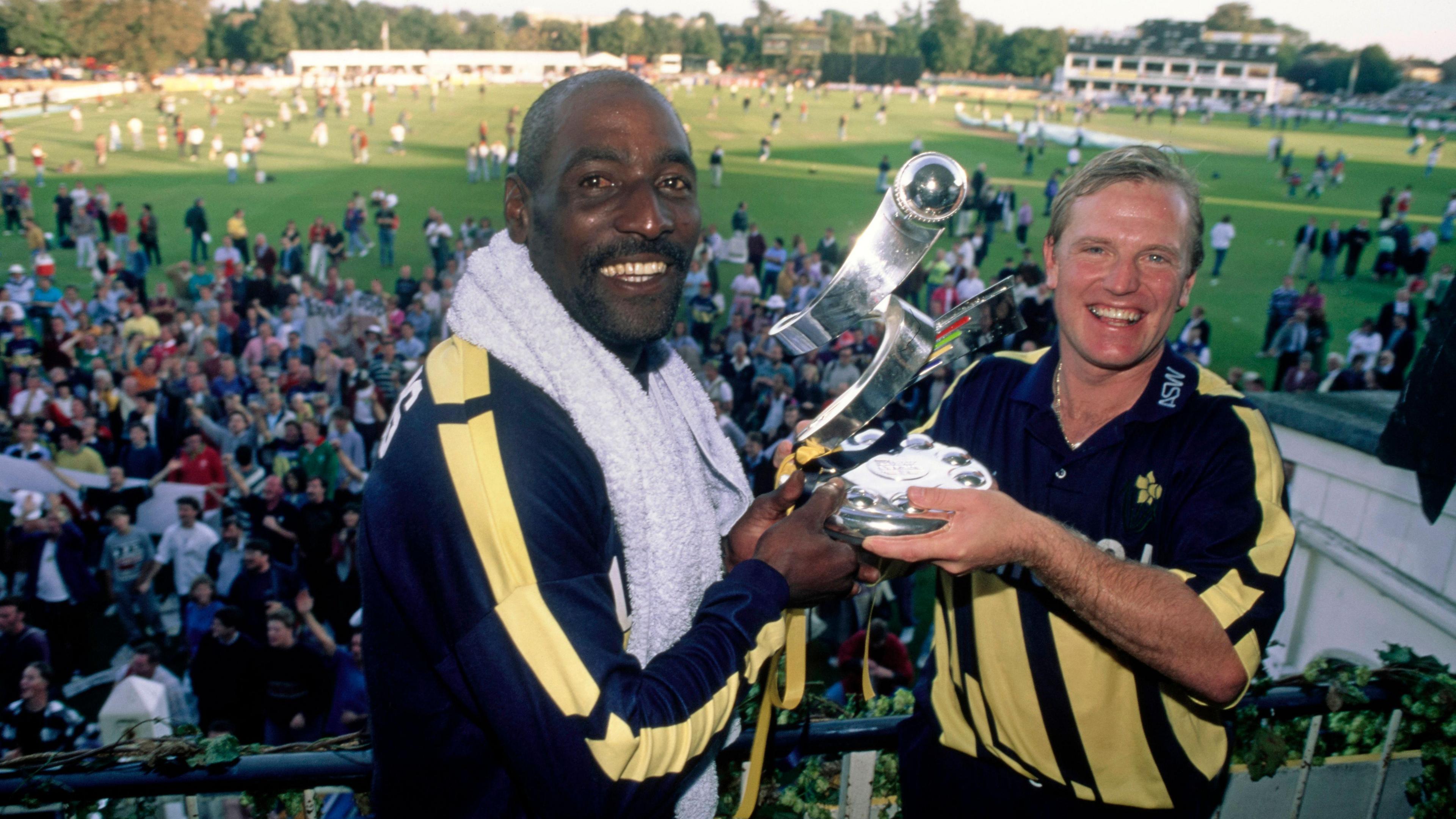 Glamorgan players Viv Richards (l) and Hugh Morris celebrate with the trophy on the balcony after winning the 1993 Axa Equity & Law Sunday League on September 19th, 1993 in Canterbury, United Kingdom