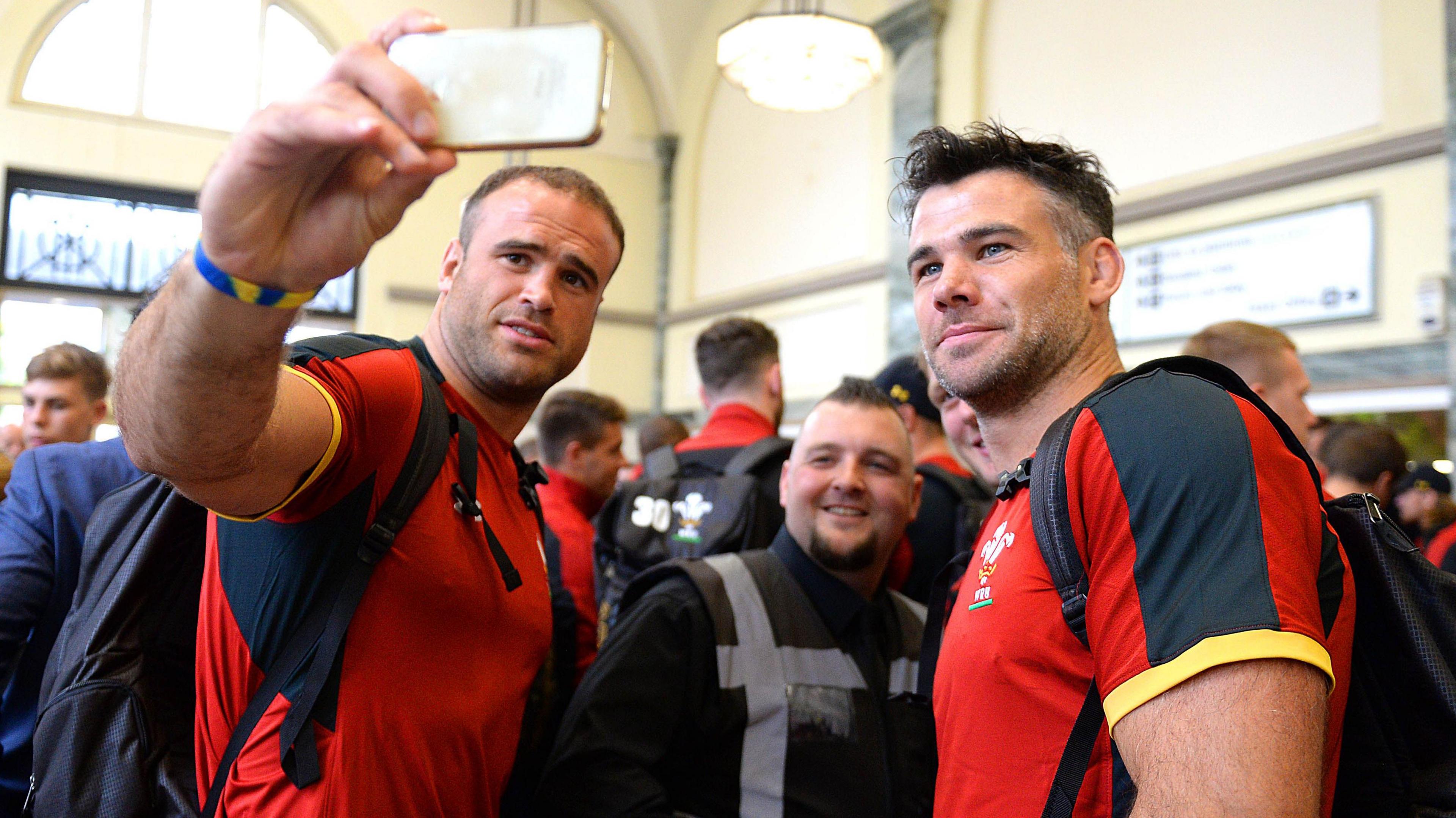 Jamie Roberts (left) and Mike Phillips (right) take a selfie with a fan