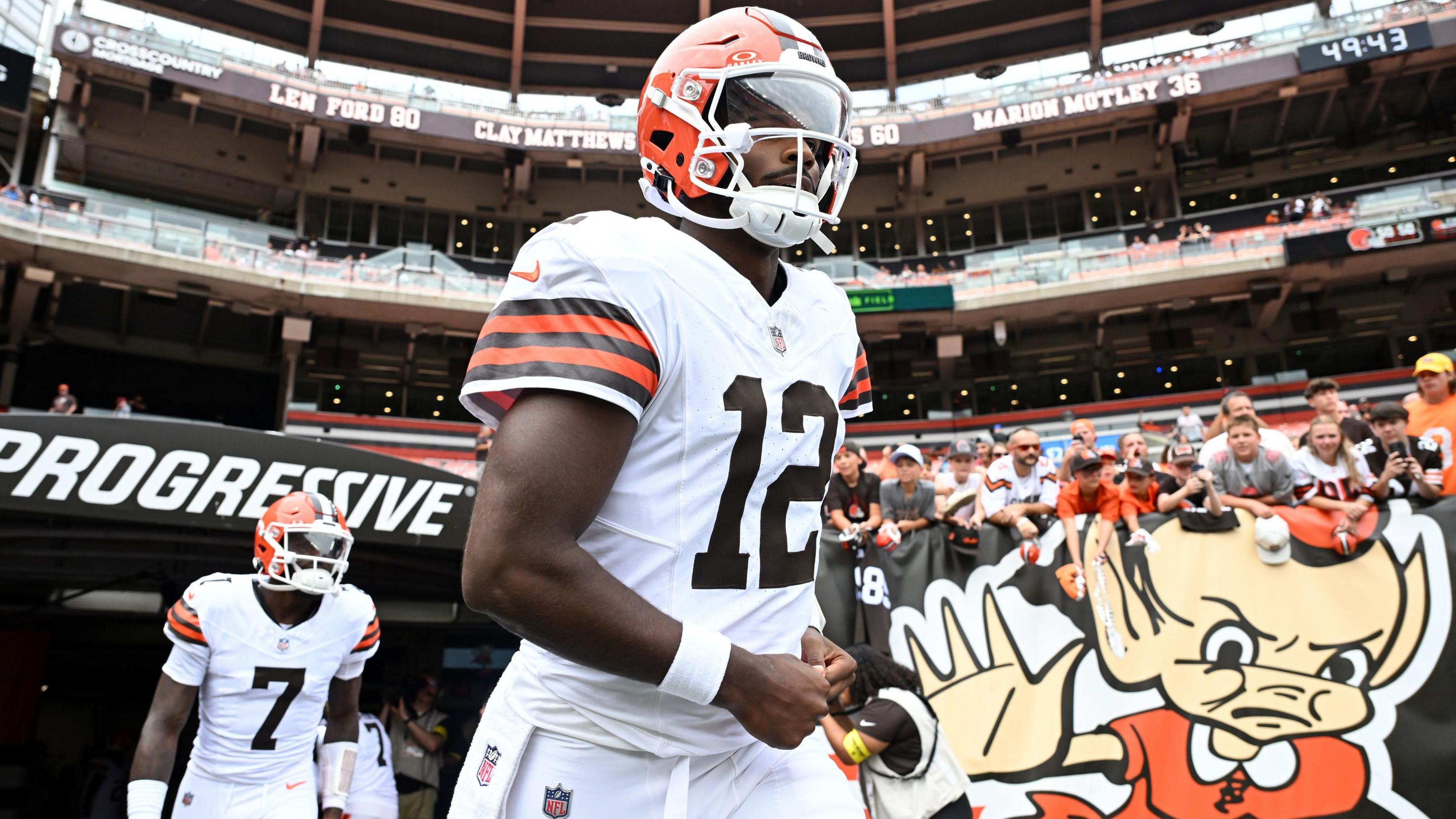 Quarterback Shedeur Sanders runs out of the tunnel while playing for the Cleveland Browns in the NFL