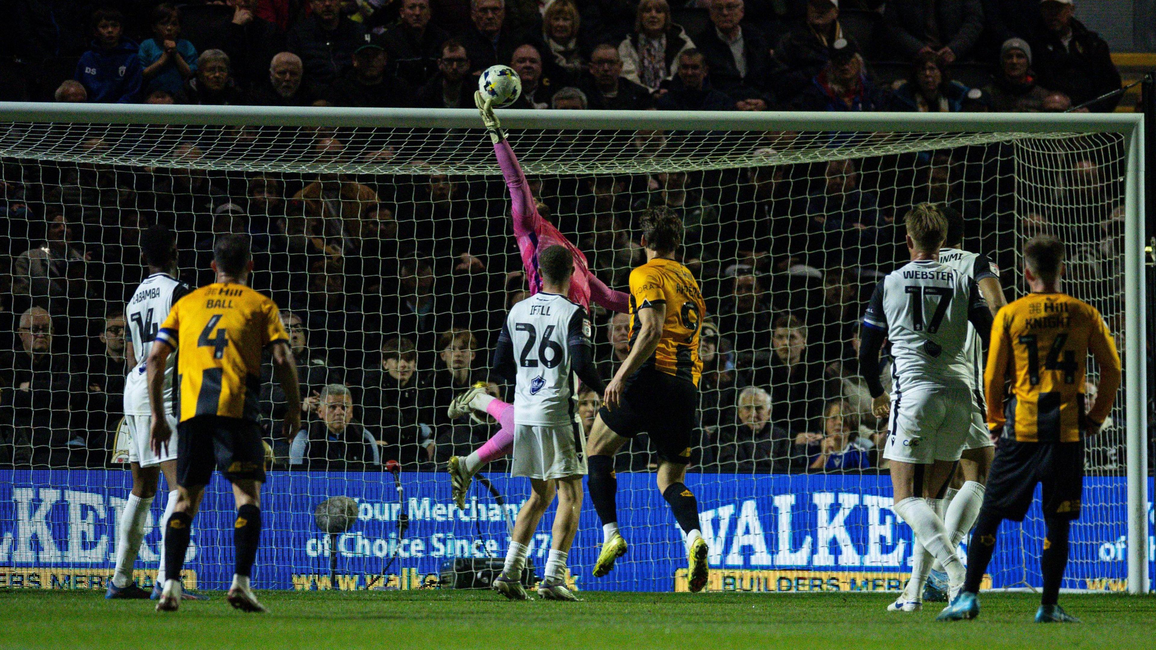 Grant Smith tips the ball over the crossbar in the Bromley net