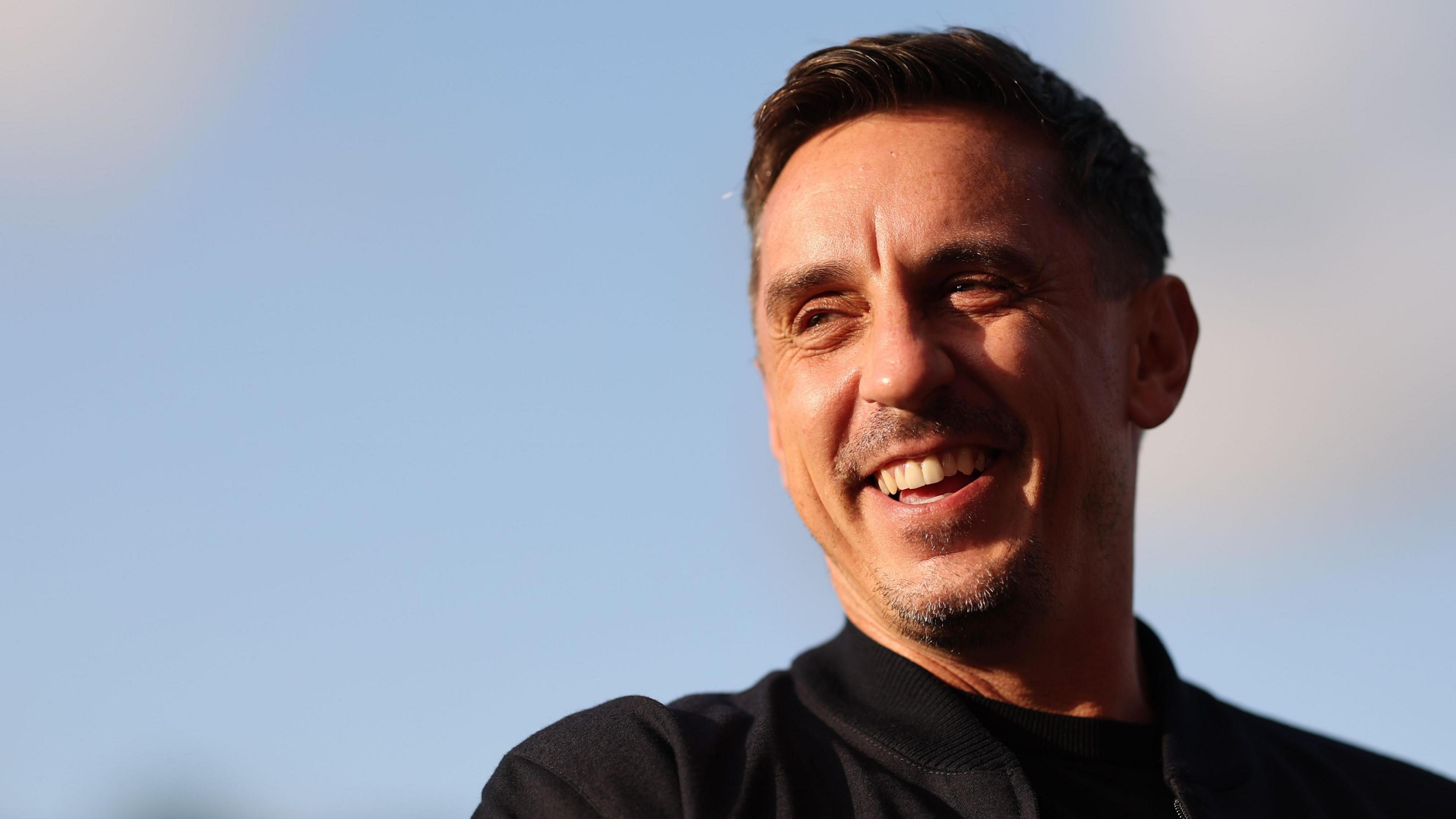 Gary Neville watches on