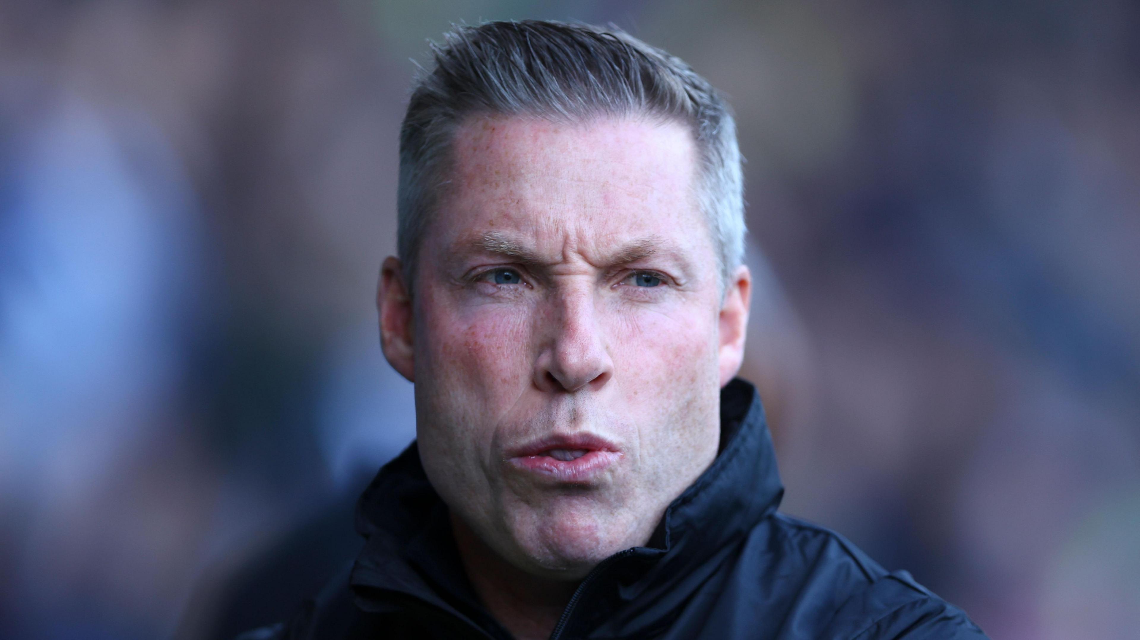 Millwall manager Neil Harris puckers his lips